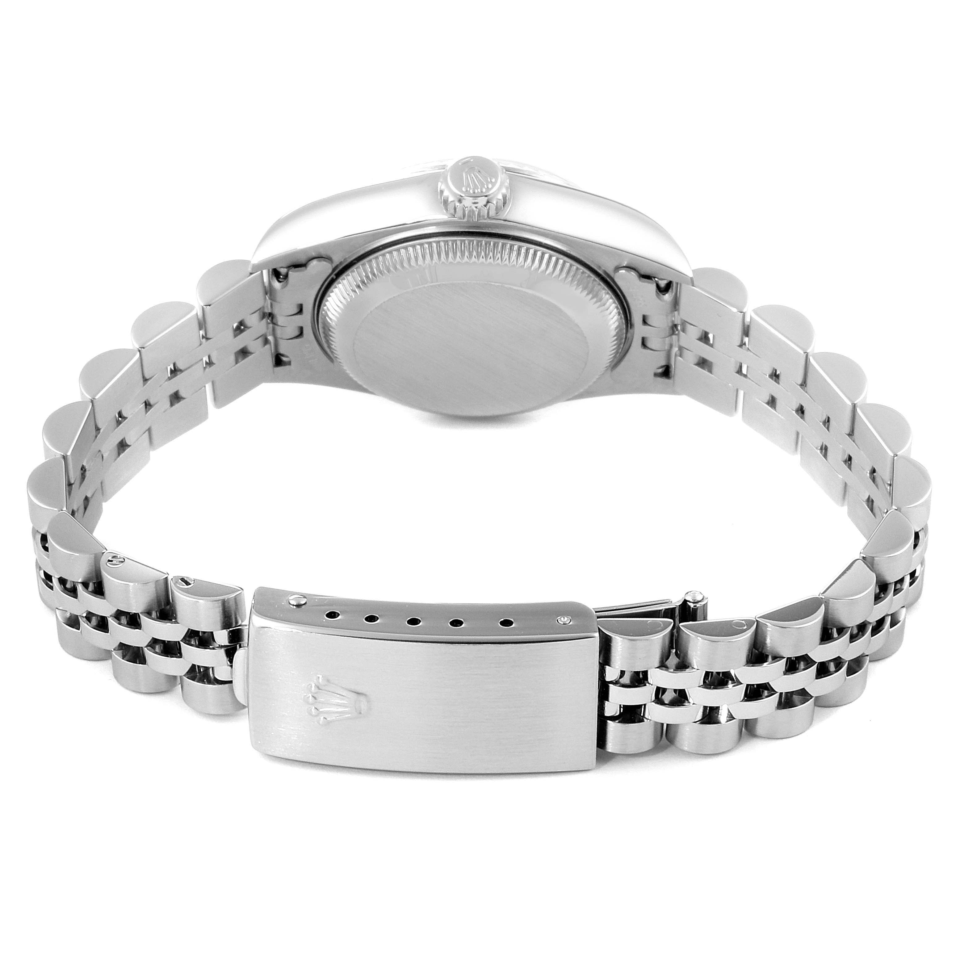 This image shows the back side of a Rolex Datejust 79174 Women's Stainless Steel Silver Dial 79174 Women's Stainless Steel Silver Dial watch, including the case back, crown, and bracelet clasp.