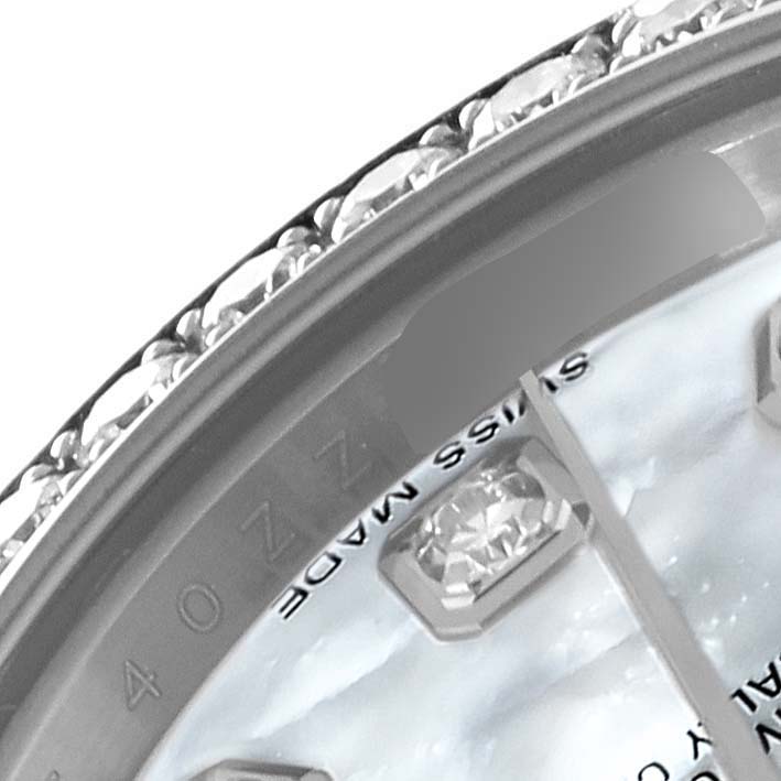 The image shows a close-up of the bezel and part of the dial of a Rolex Datejust 179384 Women's Stainless Steel Mother of Pearl Dial 179384 Women's Stainless Steel Mother of Pearl Dial watch.