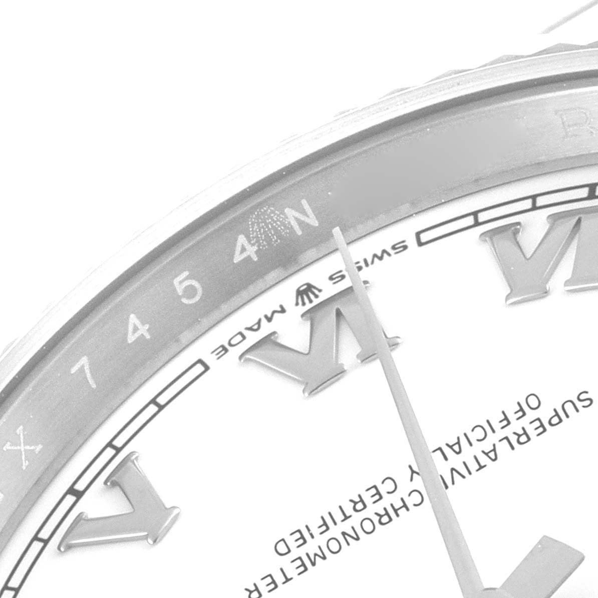 This image shows a partial close-up of the dial and bezel of the Rolex Datejust 126234 Men's Stainless Steel White Dial 126234 Men's Stainless Steel White Dial watch, displaying Roman numerals and a portion of the minute hand.