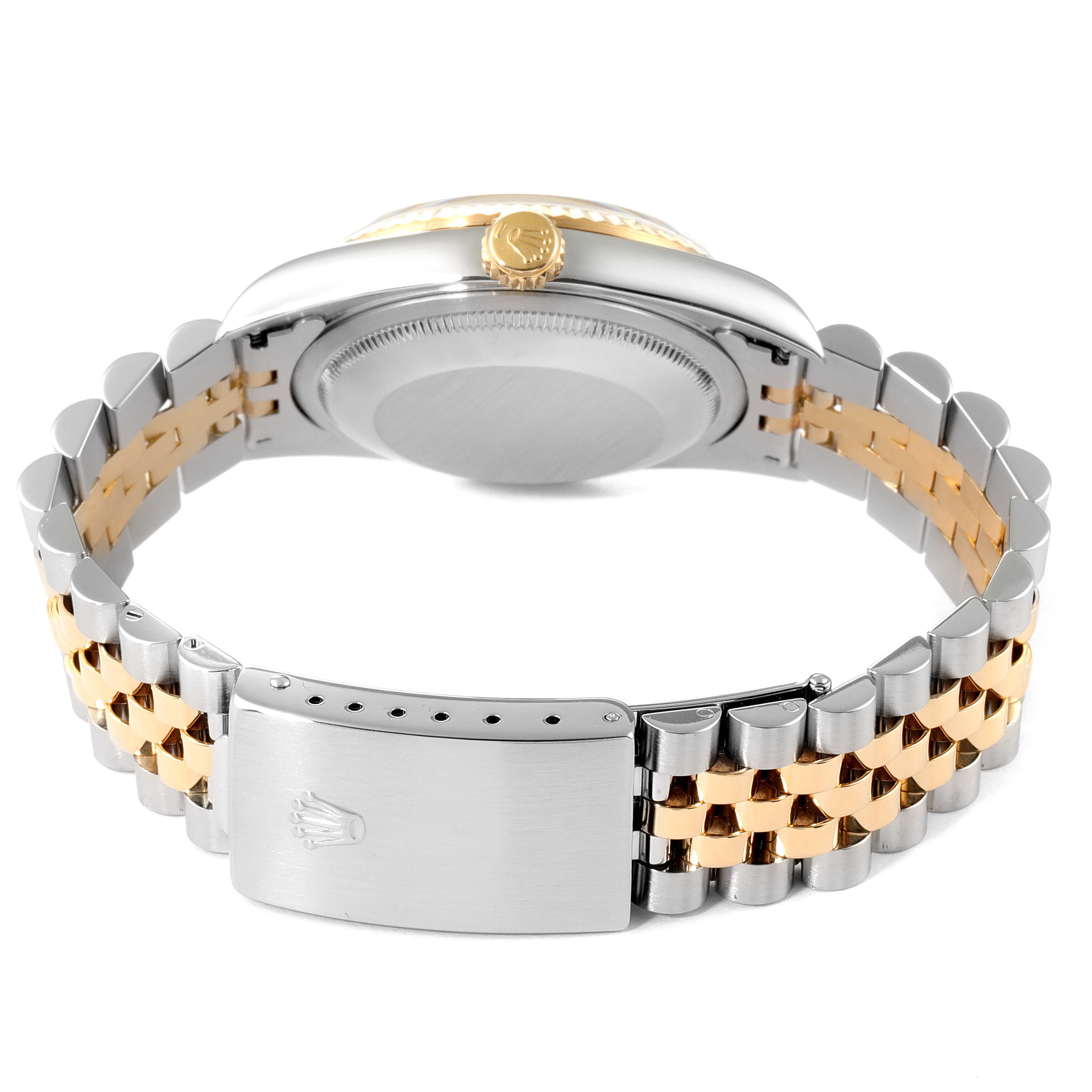 The image shows the back of a Rolex Datejust 16233 Men's Steel and Gold (two tone) Black Dial 16233 Men's Steel and Gold (two tone) Black Dial watch, highlighting its jubilee bracelet and stainless steel and gold clasp.