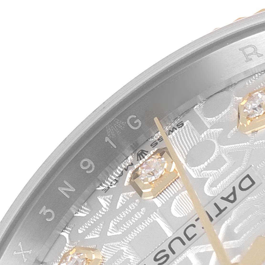 The image shows a close-up angle of the dial and part of the bezel of a Rolex Datejust 126233 Men's Steel and Gold (two tone) Silver Dial 126233 Men's Steel and Gold (two tone) Silver Dial watch.