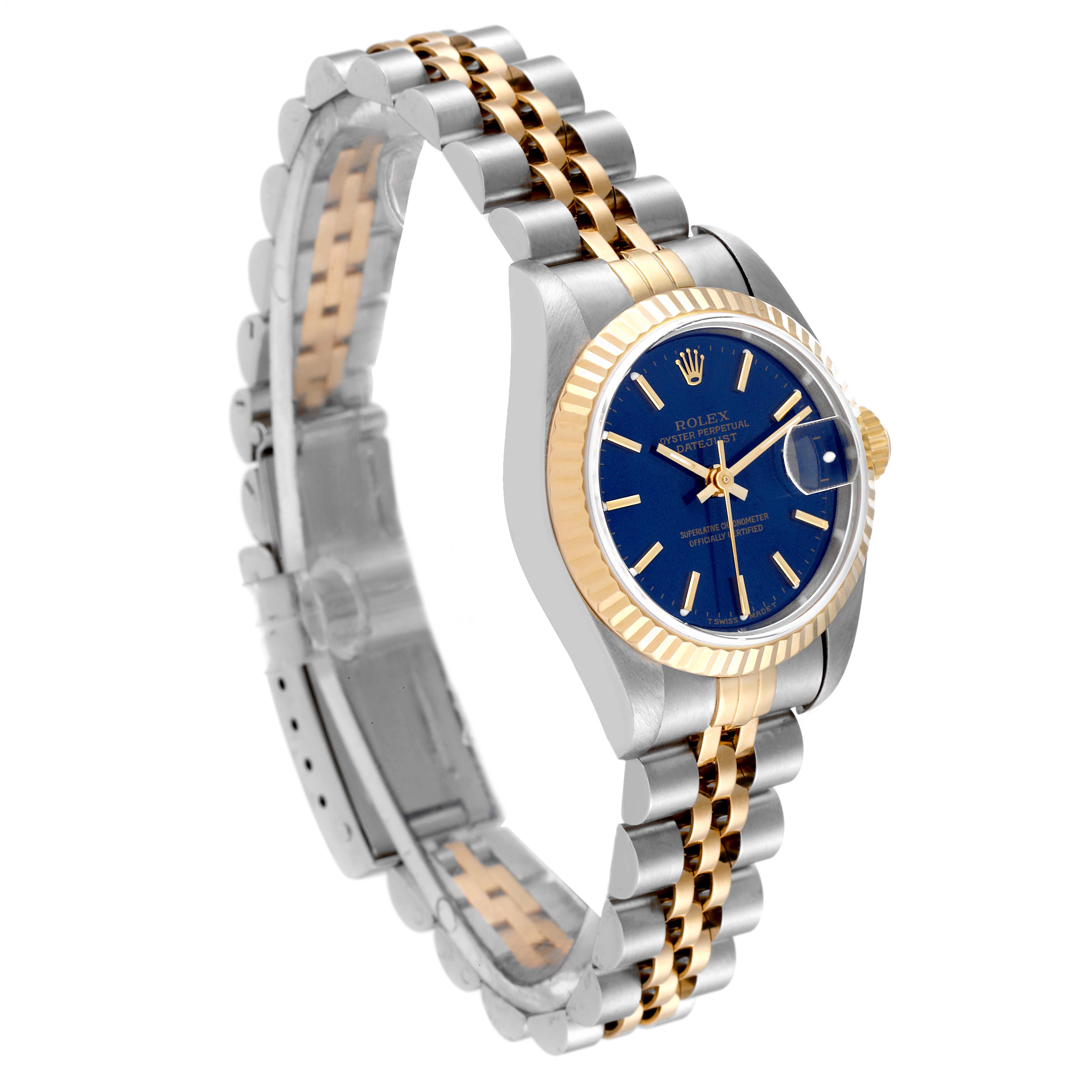 This image shows a Rolex Datejust 69173 Women's Steel and Gold (two tone) Blue Dial 69173 Women's Steel and Gold (two tone) Blue Dial watch at a three-quarter angle, highlighting its blue dial, fluted bezel, and two-tone bracelet.