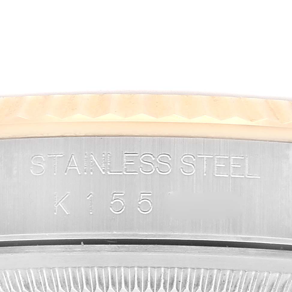 The image shows a close-up of the stainless steel caseback of a Rolex Datejust 16233 Men's Steel and Gold (two tone) Mother of Pearl Dial 16233 Men's Steel and Gold (two tone) Mother of Pearl Dial watch with the engraving partially visible.
