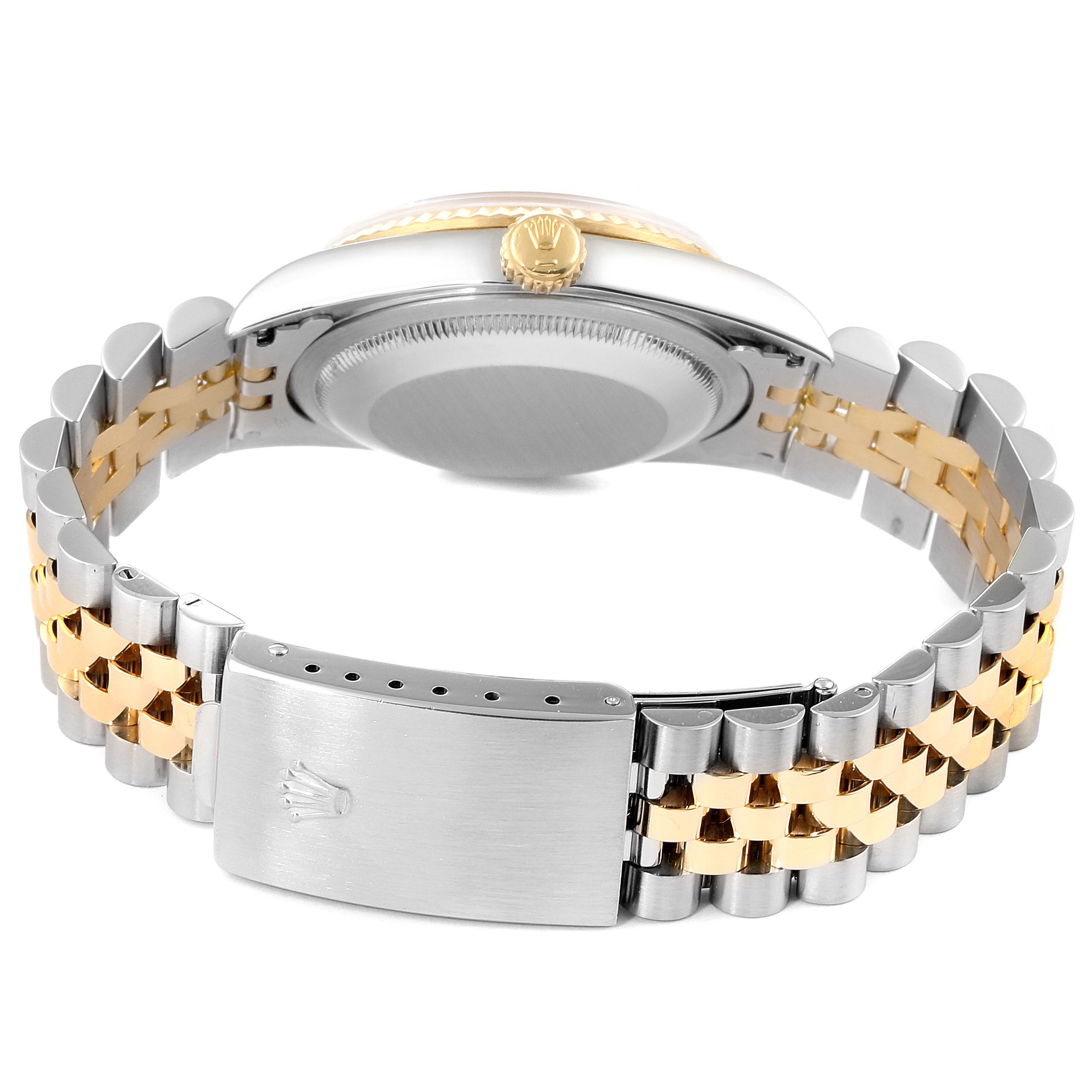 The image shows the back and clasp of a Rolex Datejust 16233 Men's Steel and Gold (two tone) Silver Dial 16233 Men's Steel and Gold (two tone) Silver Dial watch, highlighting its two-tone bracelet and crown.