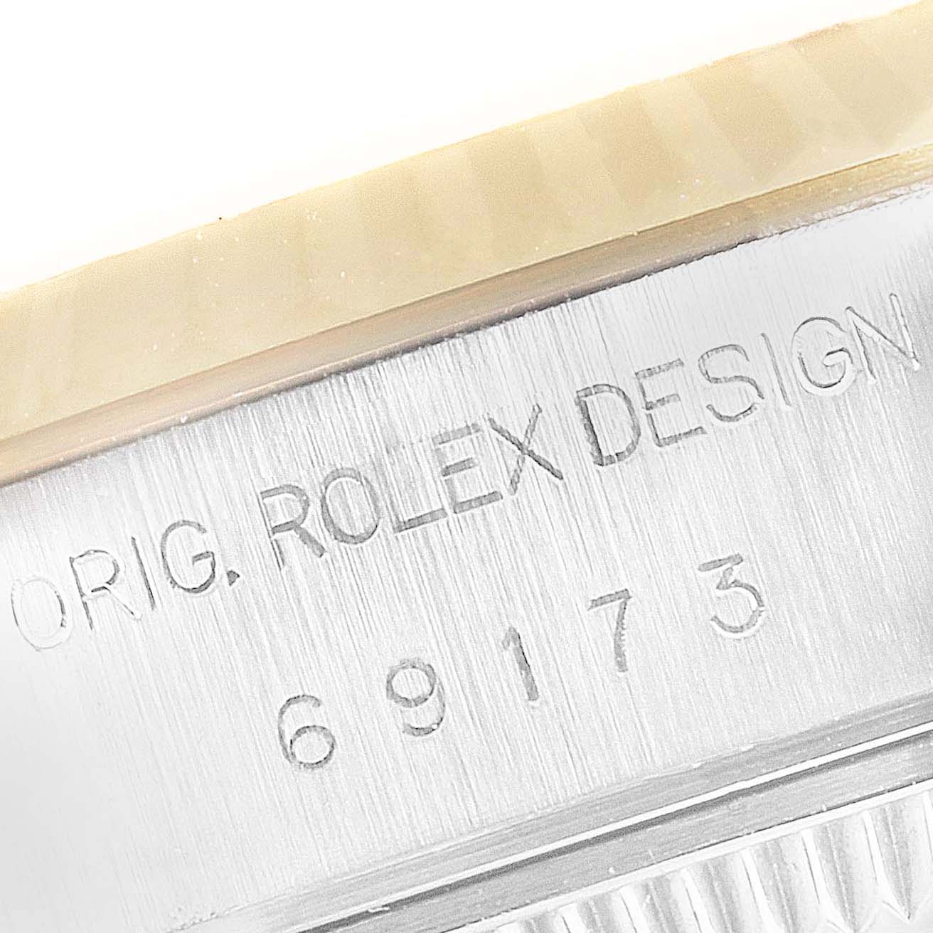 This image shows a close-up of the case side and bezel of the Rolex Datejust 69173 Women's Steel and Gold (two tone) White Dial 69173 Women's Steel and Gold (two tone) White Dial, displaying the model number and "ORIG. ROLEX DESIGN" engraving.