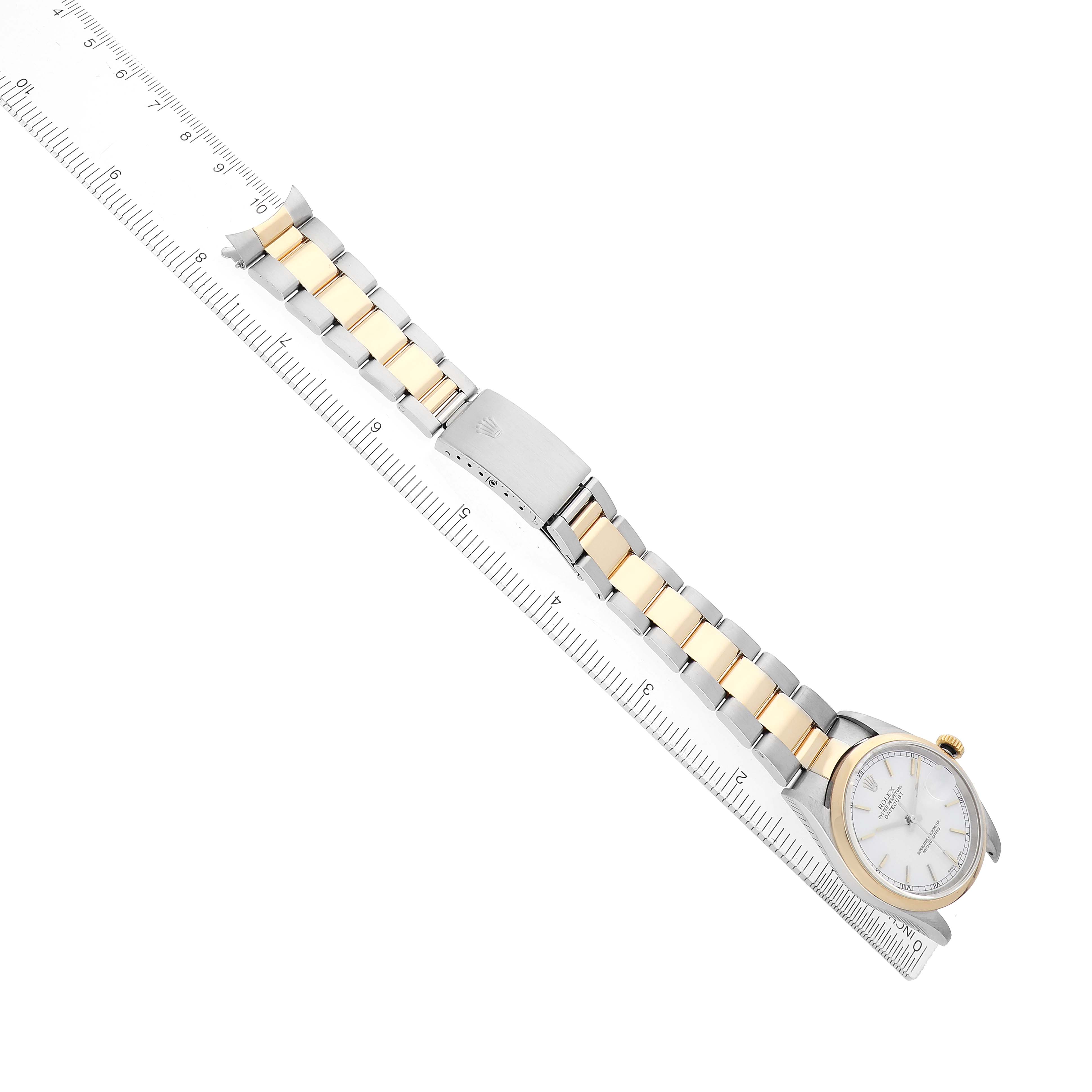 The image shows a Rolex Datejust 16203 Men's Steel and Gold (two tone) White Dial watch laid flat, showcasing its two-tone bracelet, clasp, and part of the dial from a side angle.