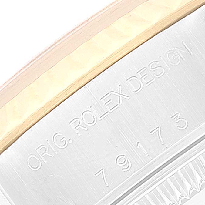 The image shows a close-up of the side of a Rolex Datejust 79173 Women's Steel and Gold (two tone) White Dial 79173 Women's Steel and Gold (two tone) White Dial watch with part of the serial number and the words "ORIG. ROLEX DESIGN".