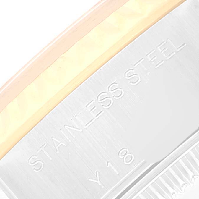 Close-up of the side of the bezel and case back of a Rolex Datejust 79173 Women's Steel and Gold (two tone) White Dial 79173 Women's Steel and Gold (two tone) White Dial, showing the "STAINLESS STEEL" engraving.