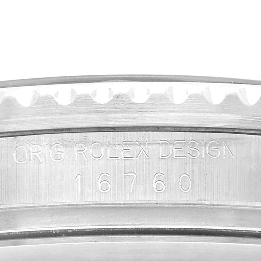 This close-up image shows the engraved side of the Rolex GMT-Master 16760 Men
s Stainless Steel Black Dial 16760 Men
s Stainless Steel Black Dial model 16760 watch case.