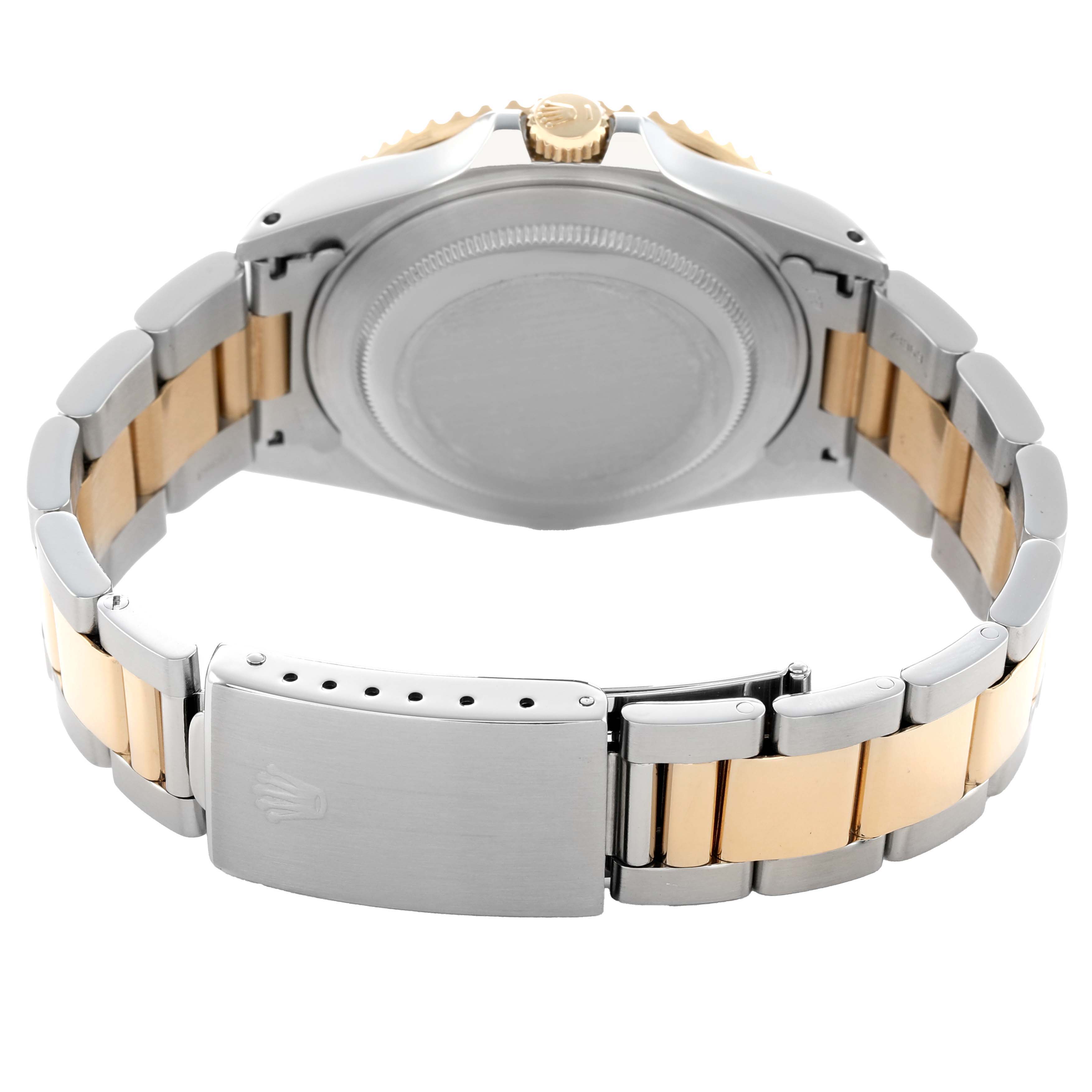 The image shows the backside of a Rolex GMT-Master 16713 Men's Steel and Gold (two tone) Black Dial, focusing on the bracelet and clasp.