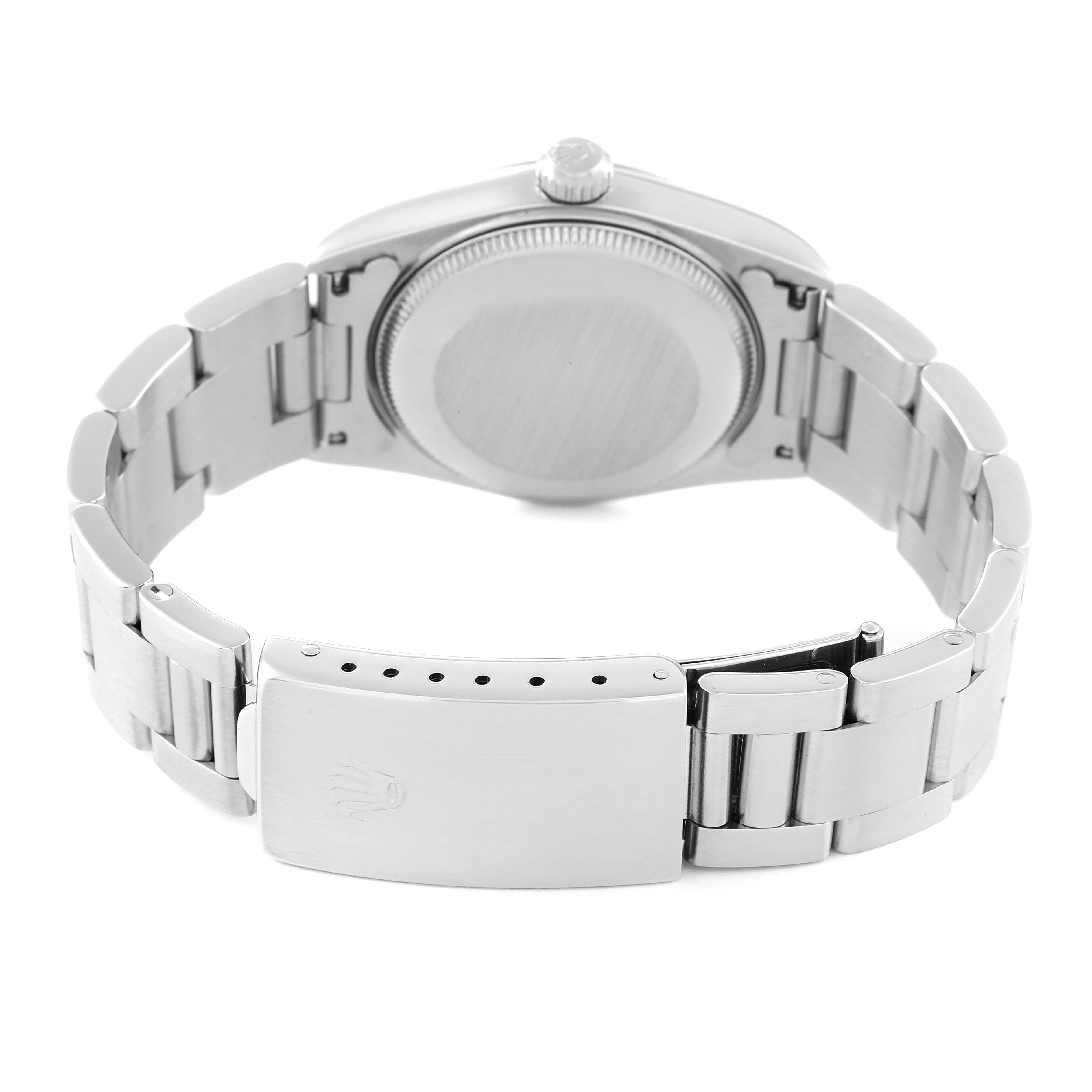 This image shows the back view of the Rolex Mid-Size 67480 Women
s Stainless Steel Blue Dial 67480 Women
s Stainless Steel Blue Dial watch, highlighting the case back, bracelet, and clasp.