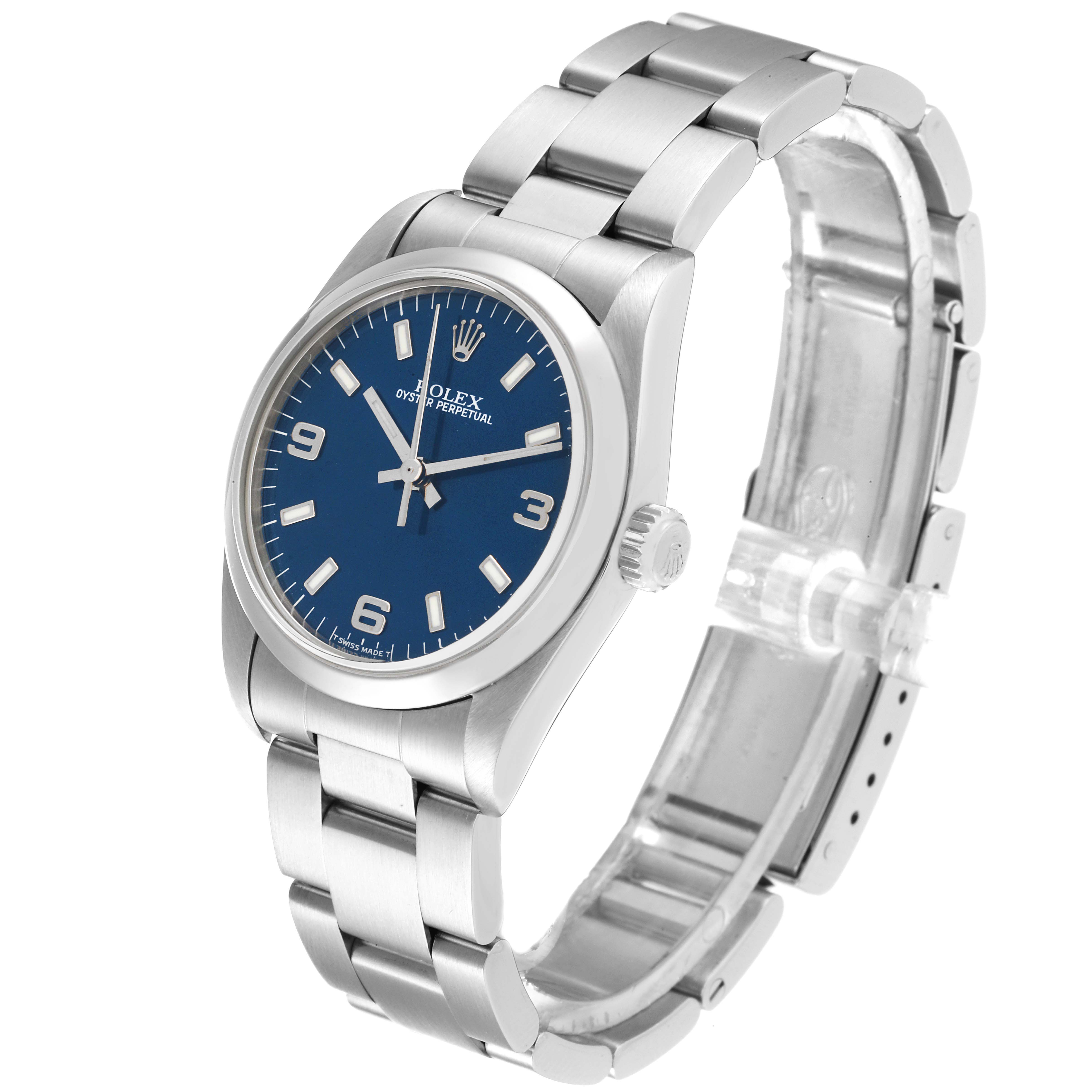 The Rolex Mid-Size 67480 Women
s Stainless Steel Blue Dial 67480 Women
s Stainless Steel Blue Dial watch is shown at an oblique angle, highlighting its blue dial, stainless steel case, and bracelet.