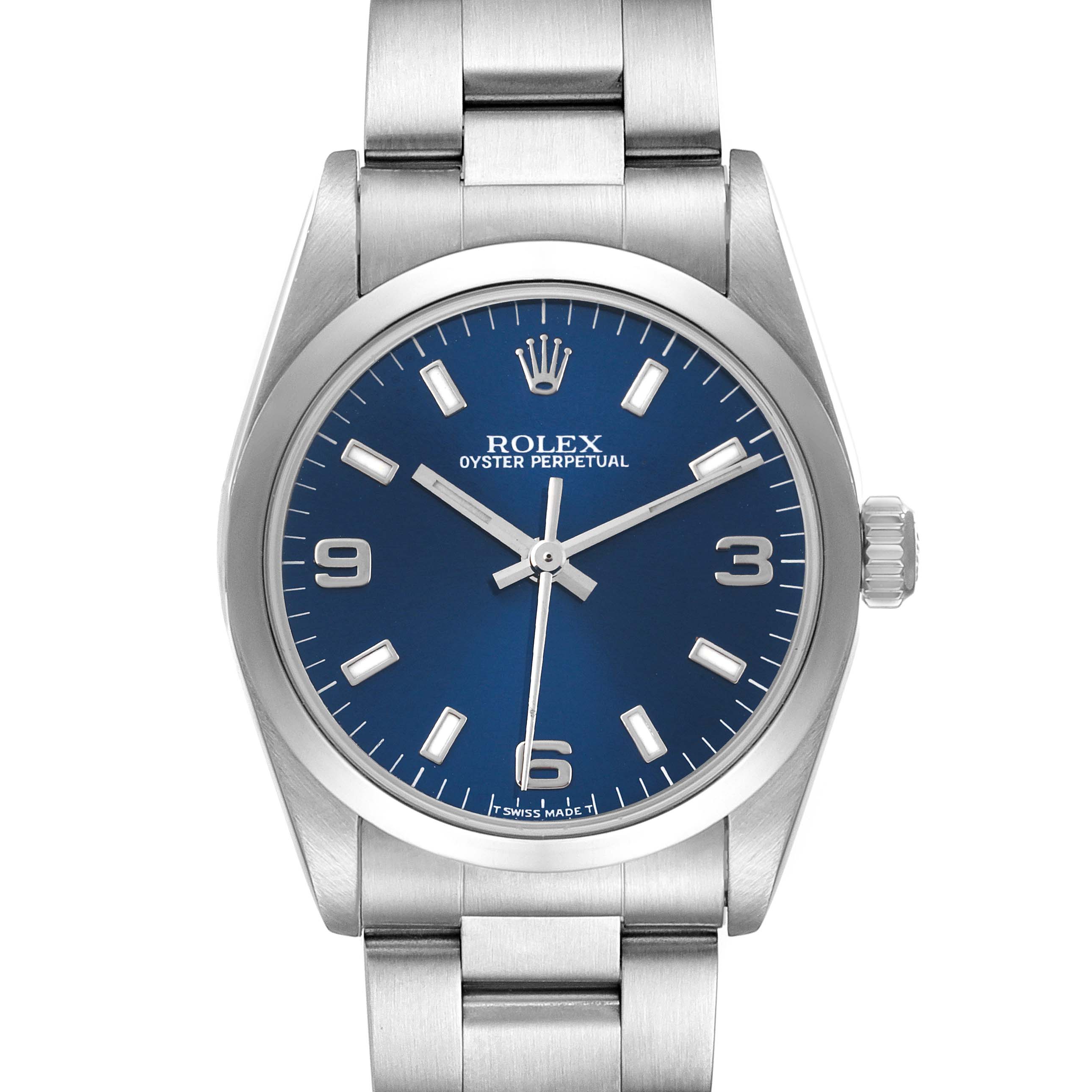 This Rolex Mid-Size 67480 Women
s Stainless Steel Blue Dial 67480 Women
s Stainless Steel Blue Dial Oyster Perpetual watch is shown from the front, displaying the blue dial, hands, markers, and bracelet.