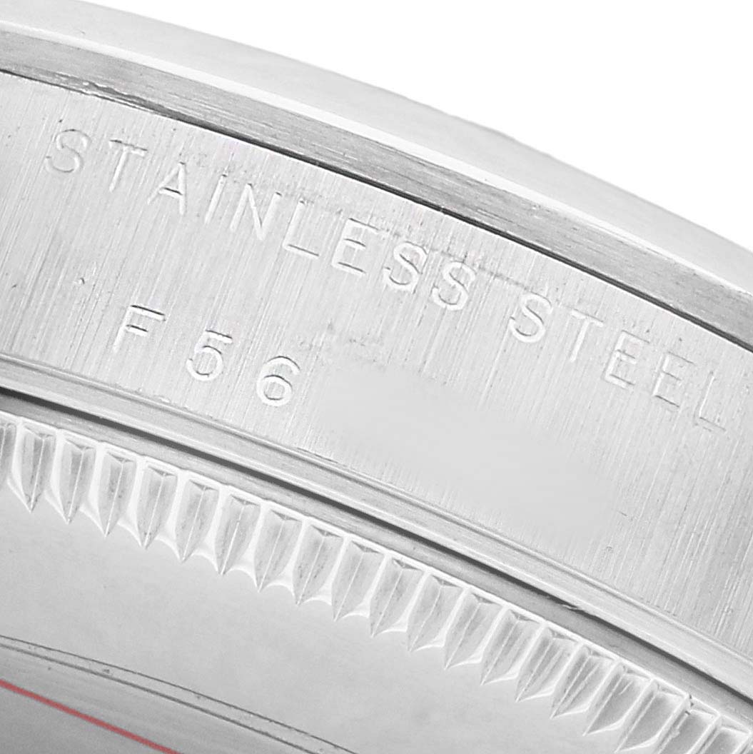 The image shows a close-up of the edge of a Rolex Mid-Size 77080 Women's Stainless Steel Black Dial stainless steel bezel with engraved markings.