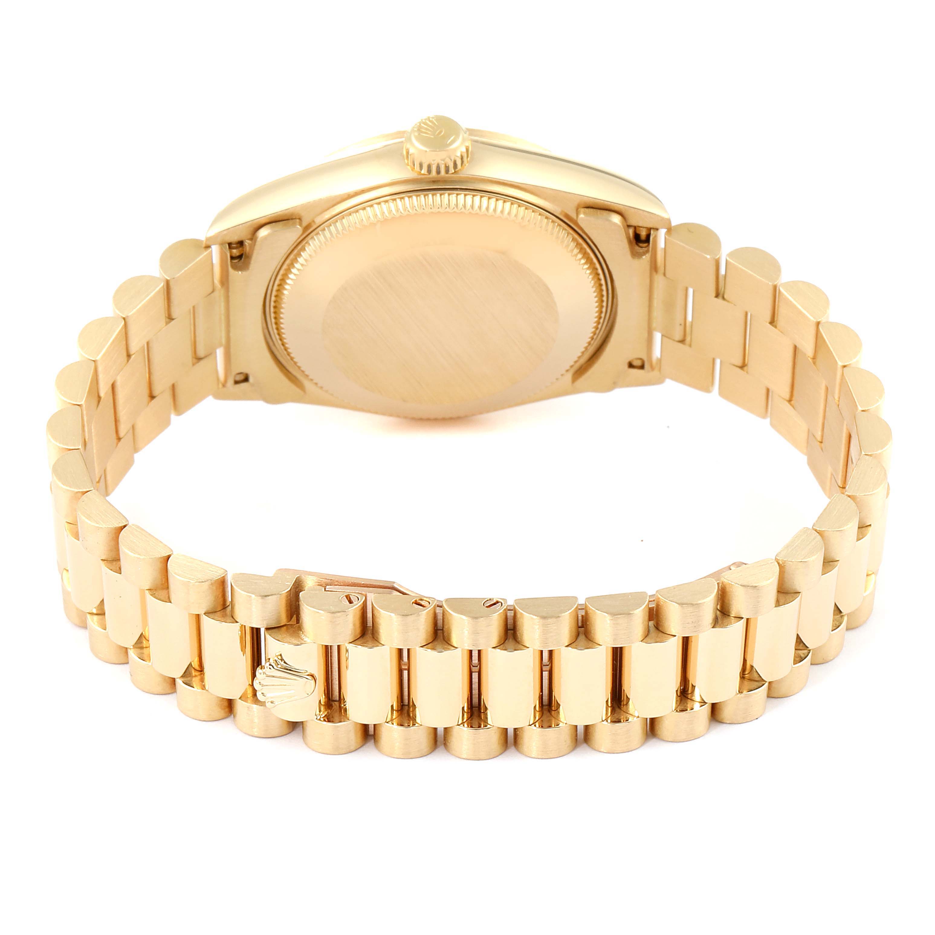 The image shows the back view of the Rolex President 68278 Women
s Yellow Gold Champagne Dial 68278 Women
s Yellow Gold Champagne Dial model watch, highlighting its case back and bracelet.