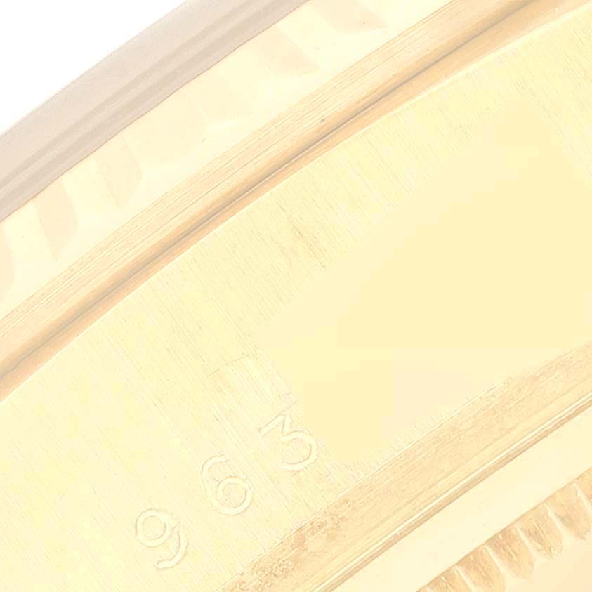 The image shows a close-up of the engraved inner bezel of a Rolex President 18038A Men
s Yellow Gold Champagne Dial 18038A Men
s Yellow Gold Champagne Dial model watch.