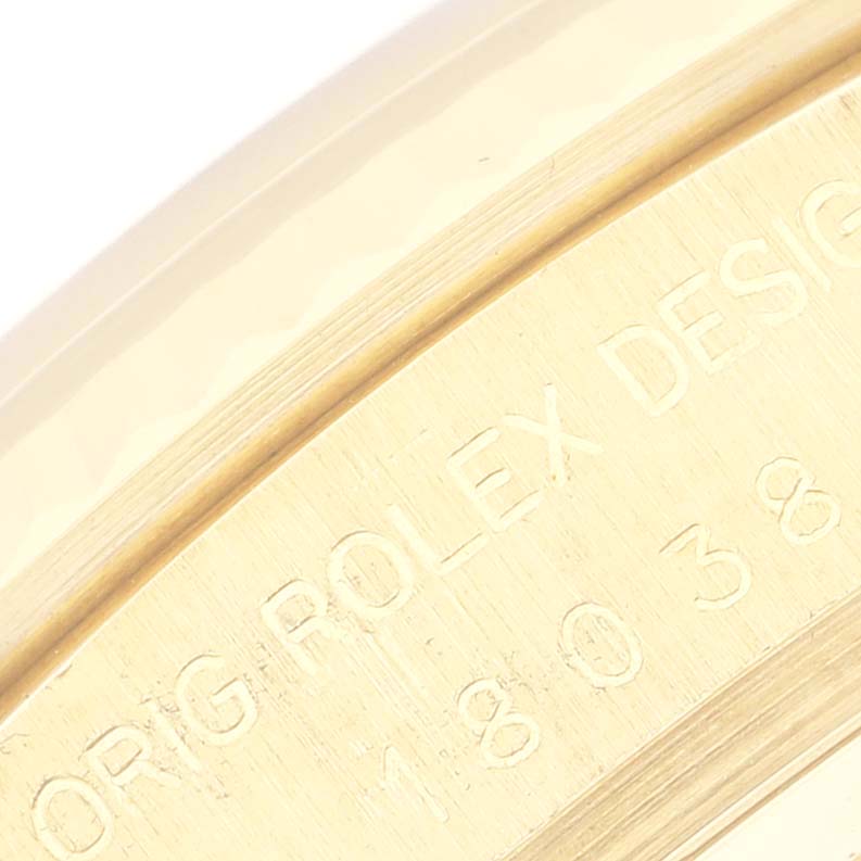 This image shows a close-up of the engraved case back edge of the President model Rolex watch.