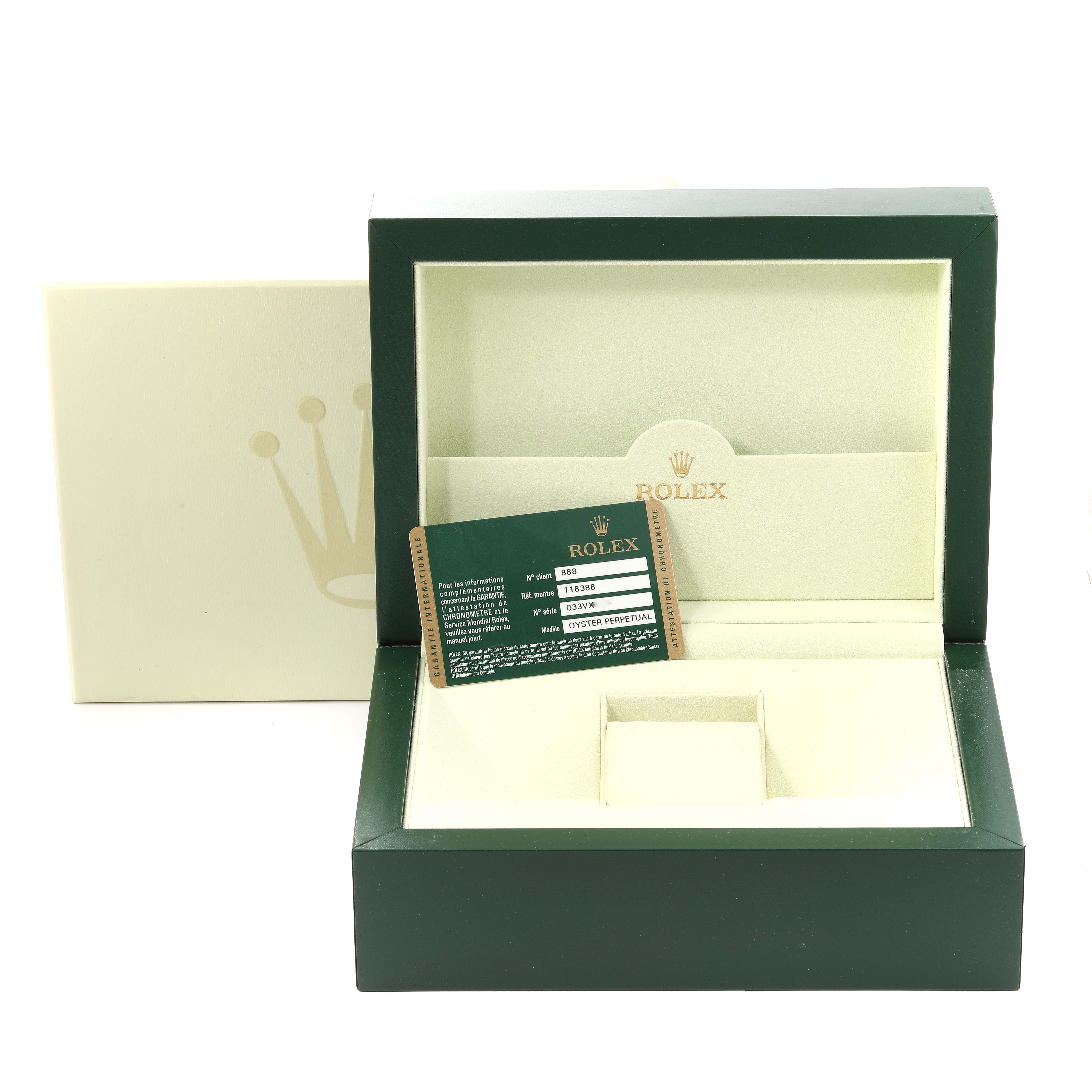 The image shows an open green and cream Rolex box for the President model, with a card displaying model details.