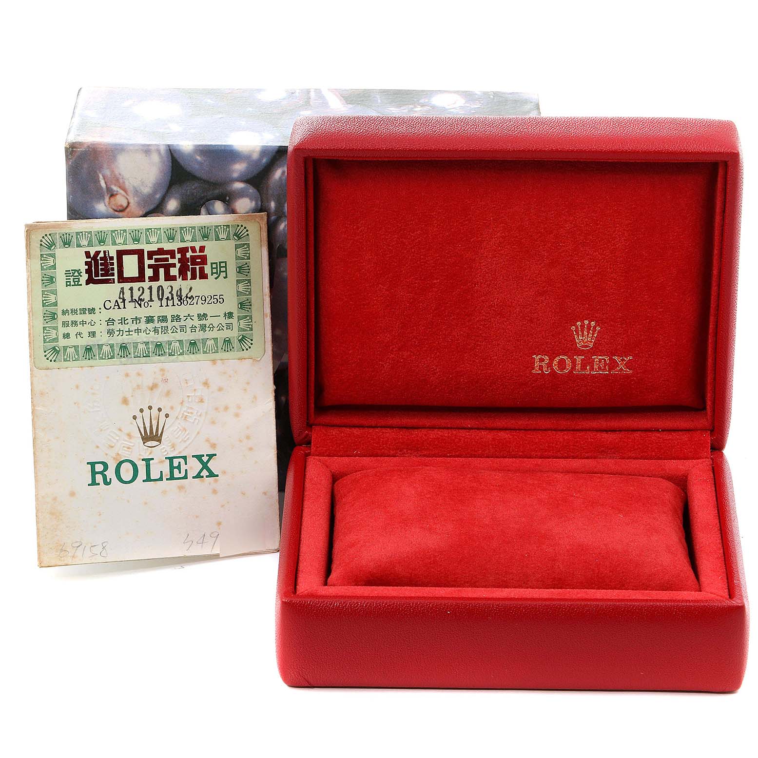 The image shows a red Rolex Datejust 69158 Women's Yellow Gold Champagne Dial 69158 Women's Yellow Gold Champagne Dial watch box and an accompanying paperwork placed beside it.