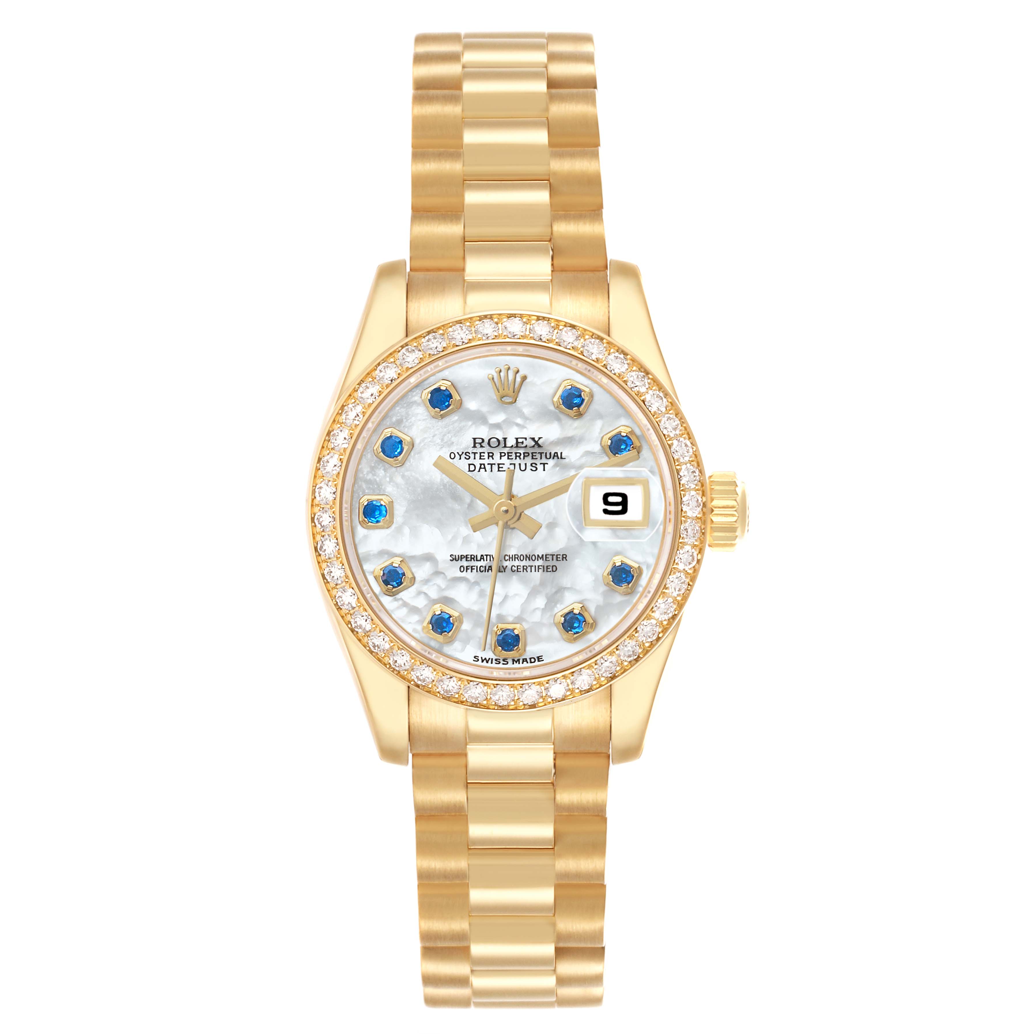 The Rolex President 179138 Women's Yellow Gold Mother of Pearl Dial model is shown from a front angle, featuring a gold bracelet, diamond-encrusted bezel, and blue-accented dial.