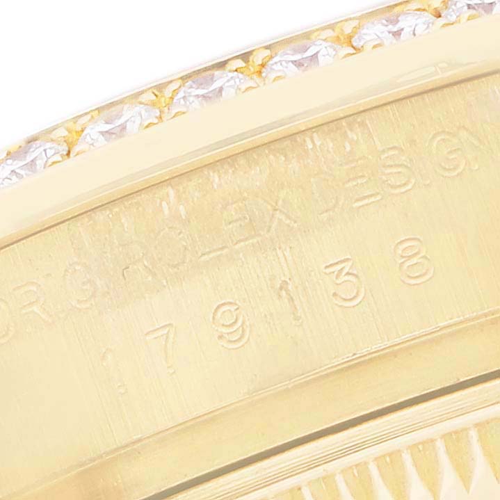 The image shows a close-up of the side of a Rolex President 179138 Women's Yellow Gold Mother of Pearl Dial model, highlighting the engravings on the inner bezel.