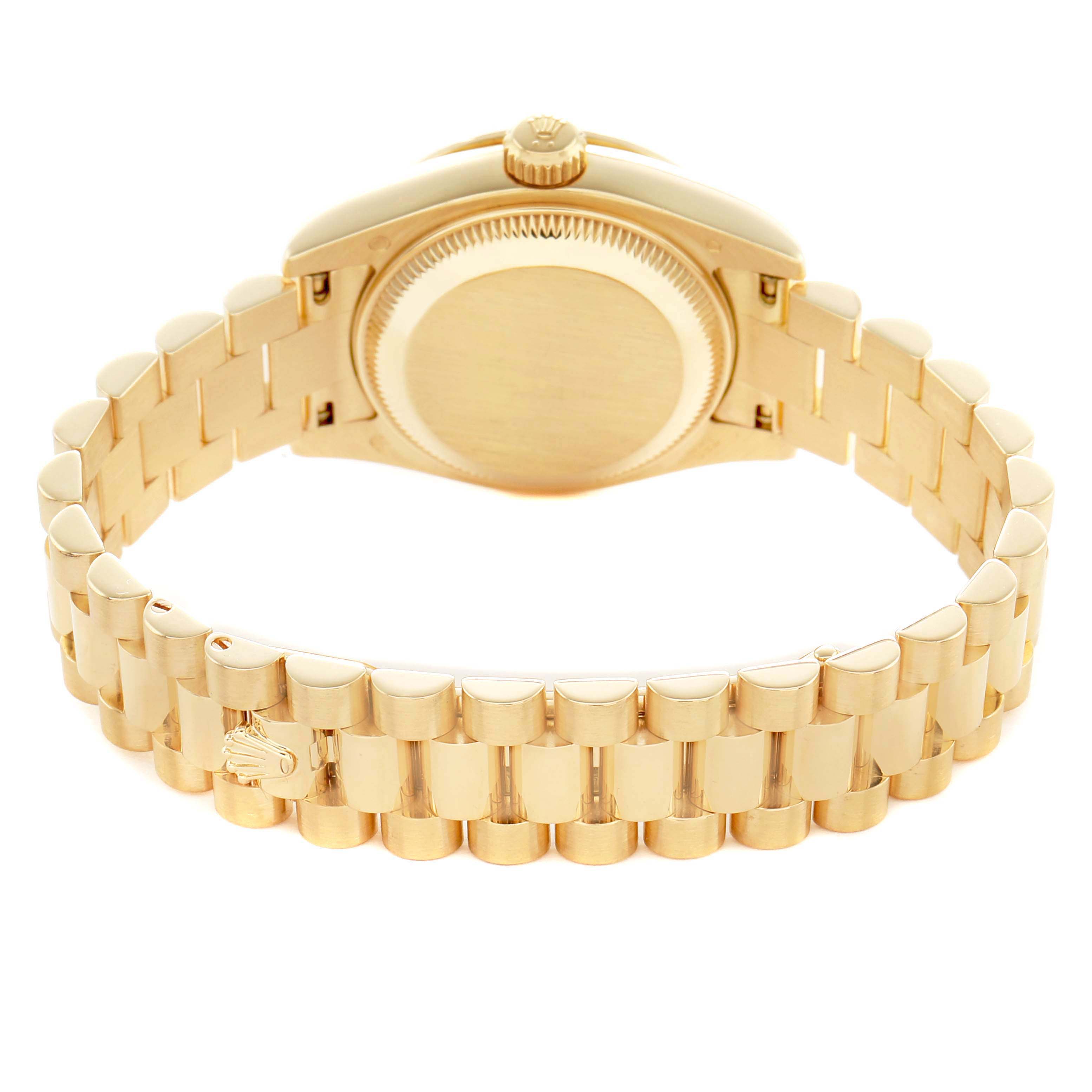 The image shows the back of a Rolex President 179138 Women's Yellow Gold Mother of Pearl Dial model watch, highlighting its case back and bracelet from a rear angle.