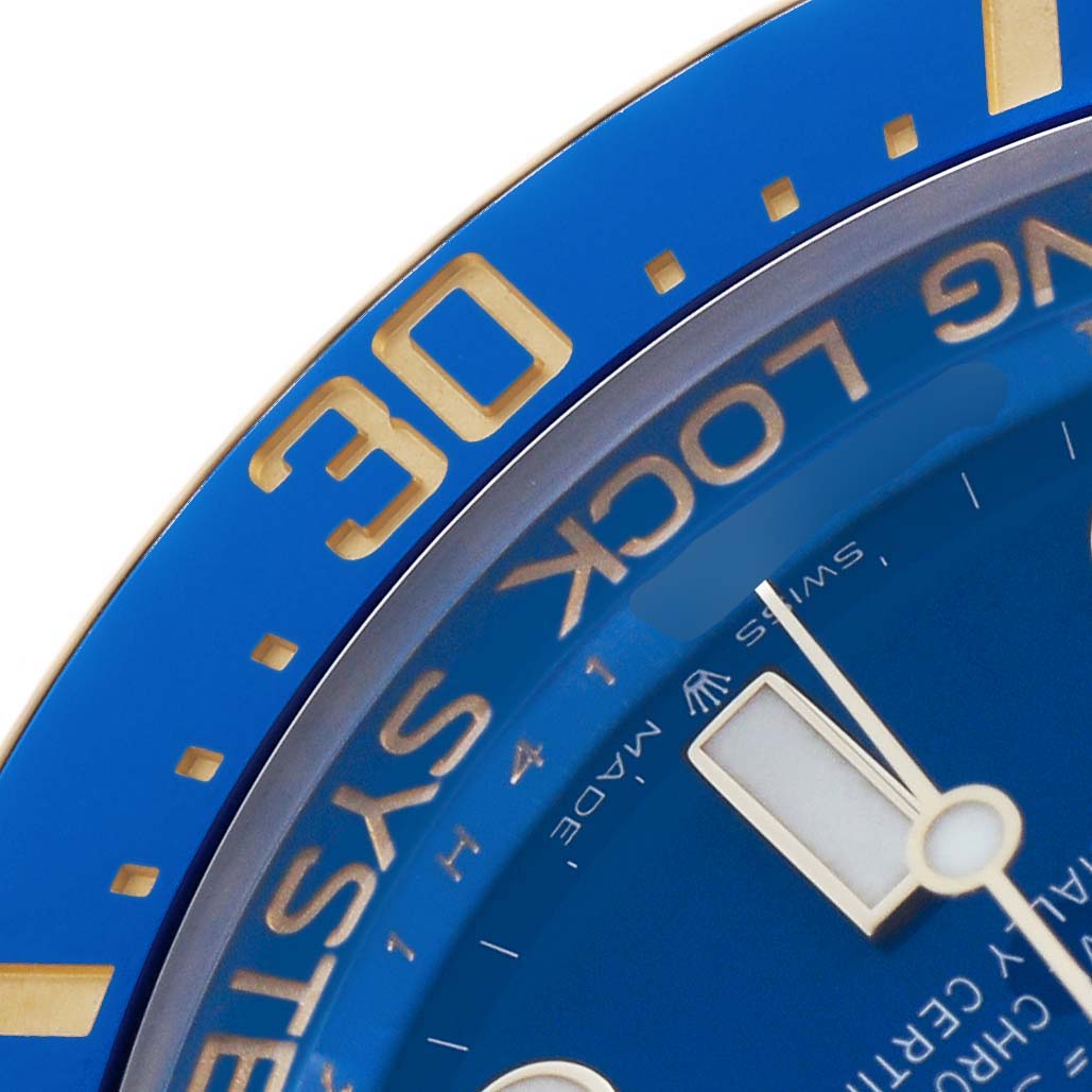 The image shows a close-up of the bezel and part of the dial of a Rolex Sea-Dweller 136668 Men's Yellow Gold Blue Dial, highlighting the 30-minute marker.