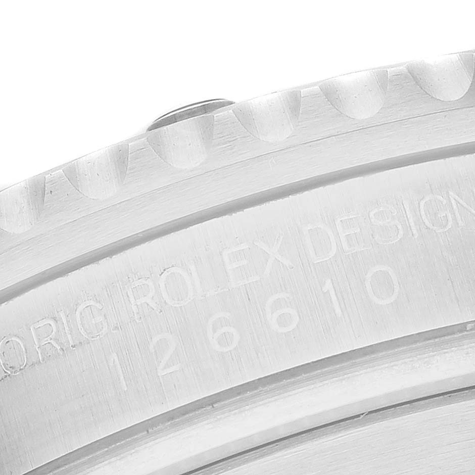 This image shows a close-up view of the caseback edge and part of the bezel of a Rolex Submariner 126610LN Men
s Stainless Steel Black Dial 126610LN Men
s Stainless Steel Black Dial watch.