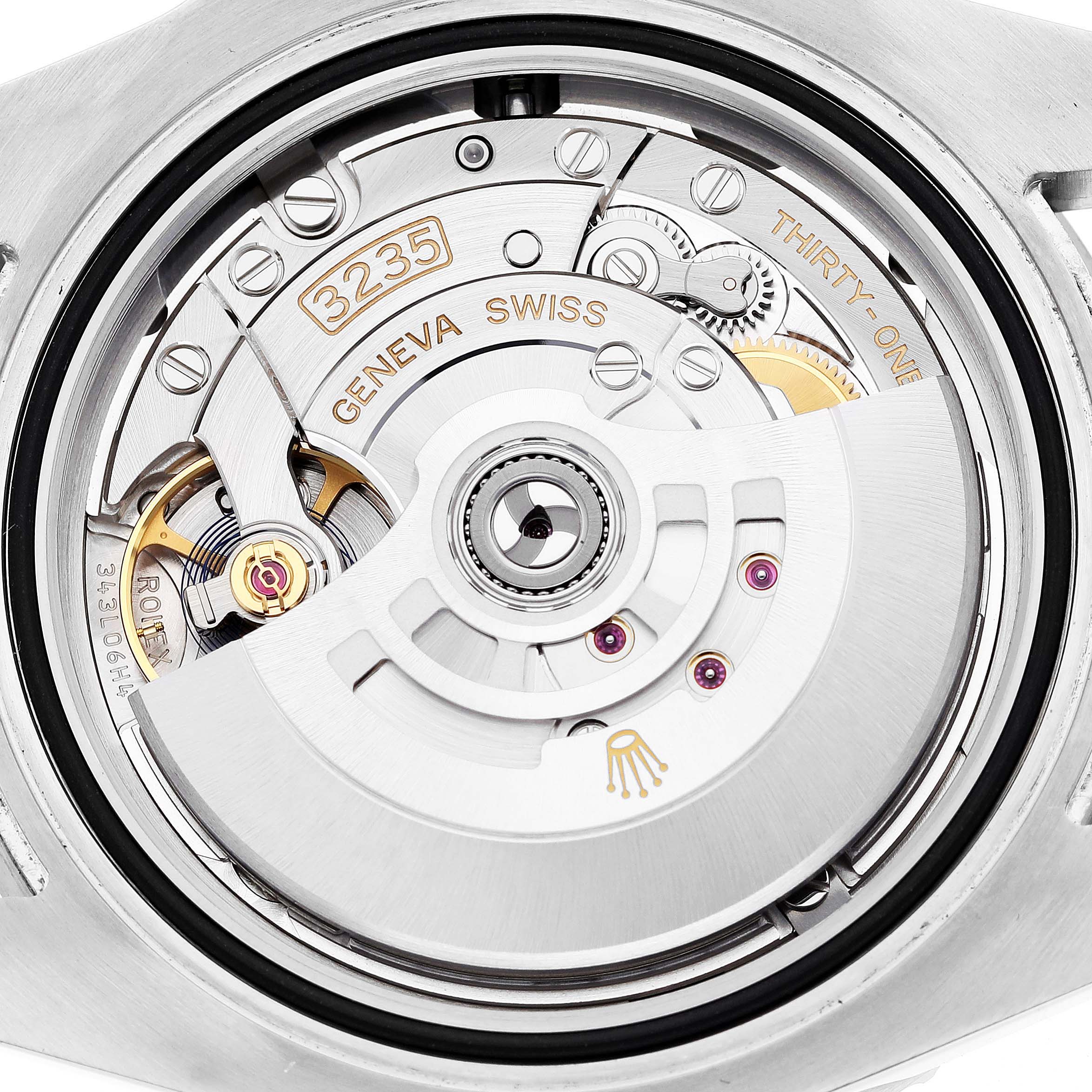This image shows the movement mechanism of a Rolex Submariner 126610LN Men
s Stainless Steel Black Dial 126610LN Men
s Stainless Steel Black Dial watch from the back, showcasing the intricate details of the caliber 3235.