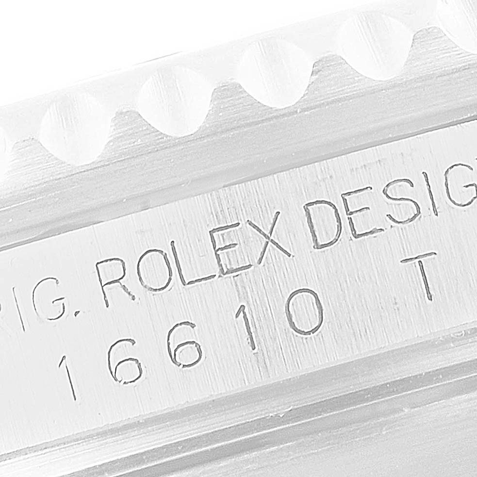 This image highlights the engraved side of a Rolex Submariner 16610 Men
s Stainless Steel Black Dial 16610 Men
s Stainless Steel Black Dial bezel, specifically showing the design identifier 16610.