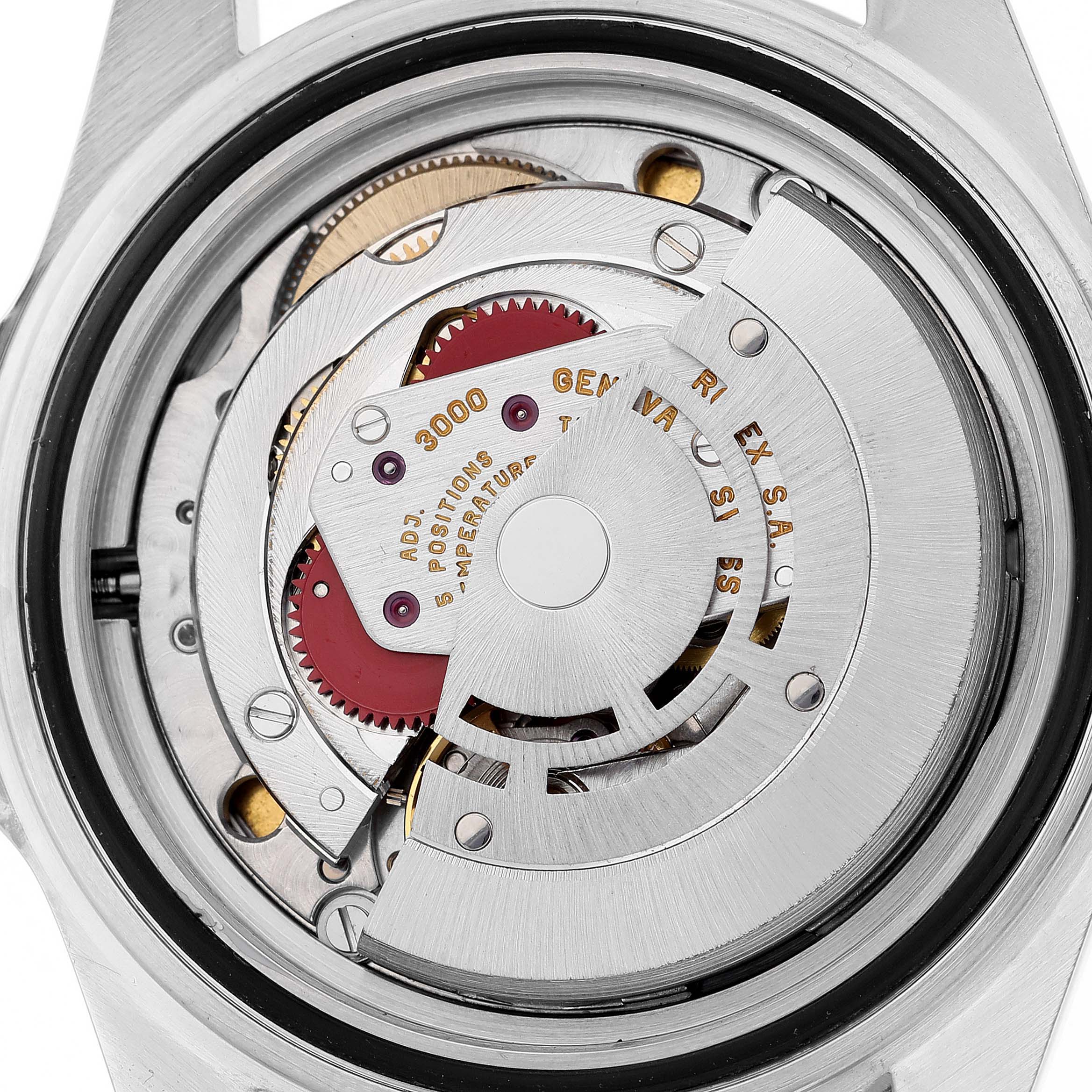 The image shows the intricate mechanical movement of the Rolex Submariner 14060 Men
s Stainless Steel Black Dial 14060 Men
s Stainless Steel Black Dial watch viewed from the back.