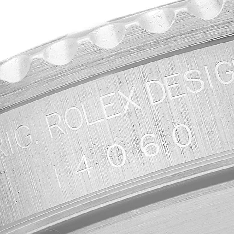 The image shows a close-up of the engraved model number and part of the bezel on a Rolex Submariner 14060 Men
s Stainless Steel Black Dial 14060 Men
s Stainless Steel Black Dial watch.