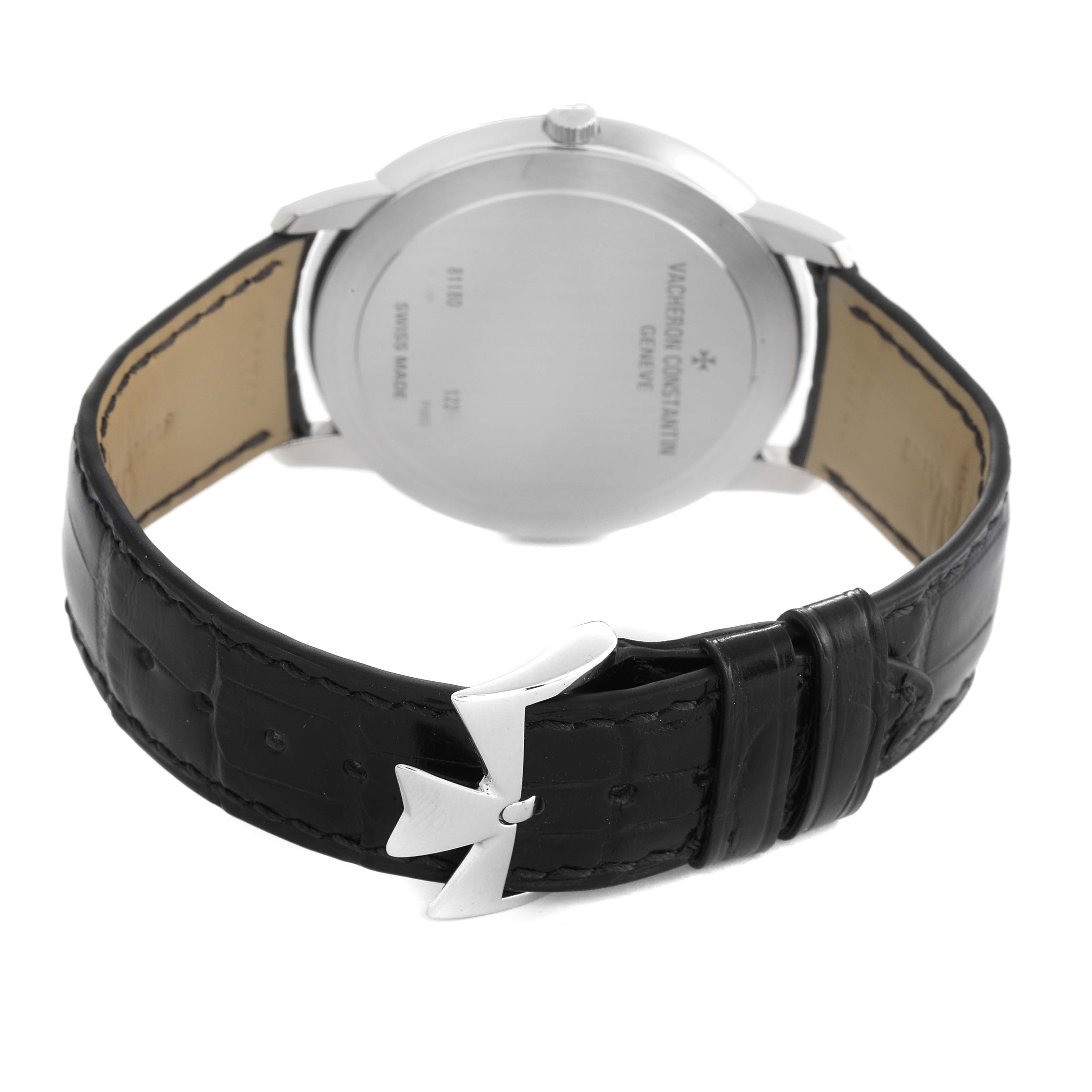 The image shows the back and clasp of a Vacheron Constantin Patrimony 81180/000P-9539 Men's Platinum Grey Dial 81180/000P-9539 Men's Platinum Grey Dial watch, emphasizing the leather strap and engraved case back.