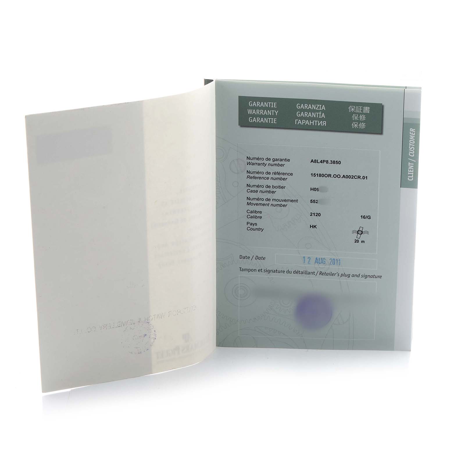 The image shows a warranty booklet for an Audemars Piguet Jules 15180R Men's Rose Gold Black Dial model, opened to display details.