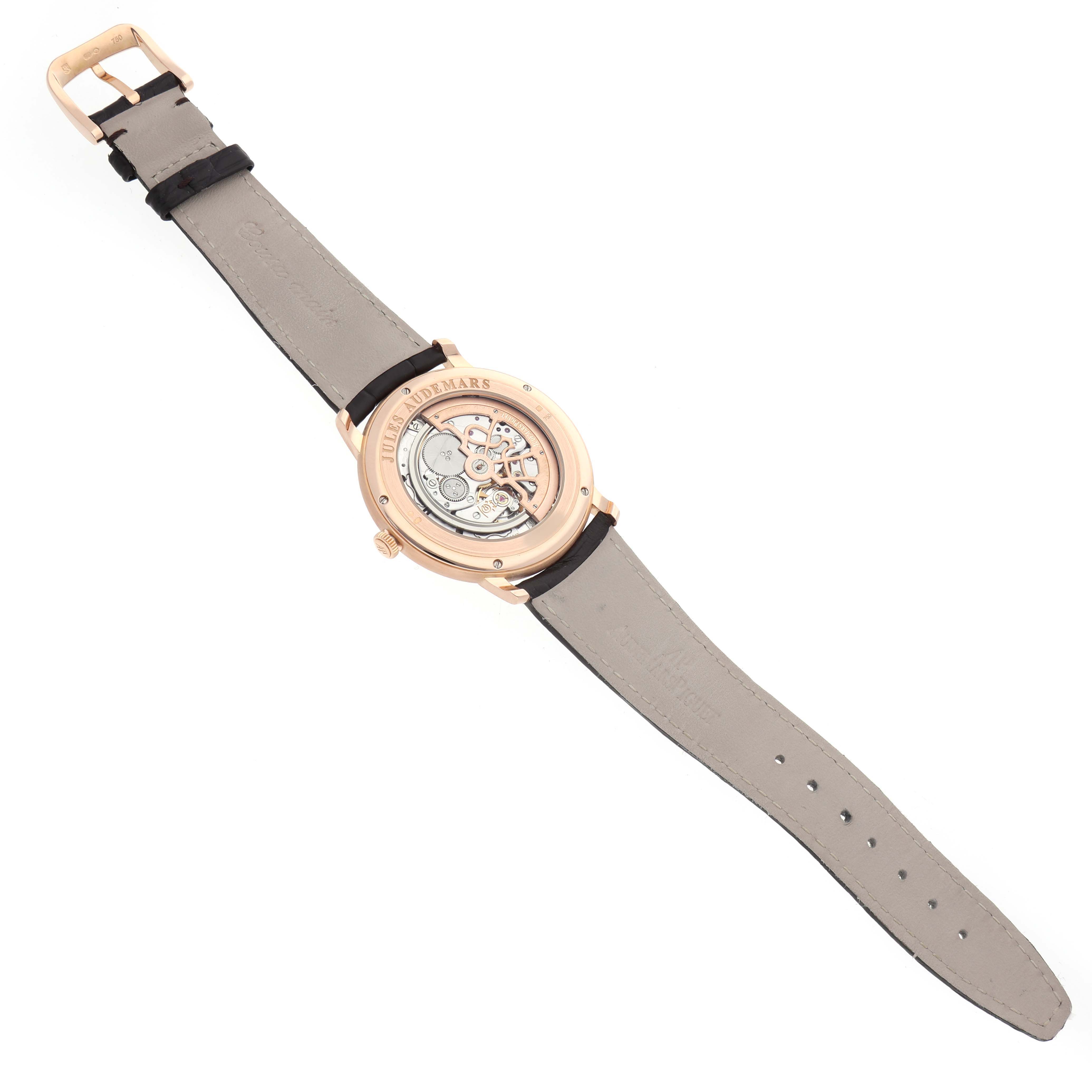 The image shows the back of the Audemars Piguet Jules 15180R Men's Rose Gold Black Dial watch, highlighting its intricate mechanism and leather strap.