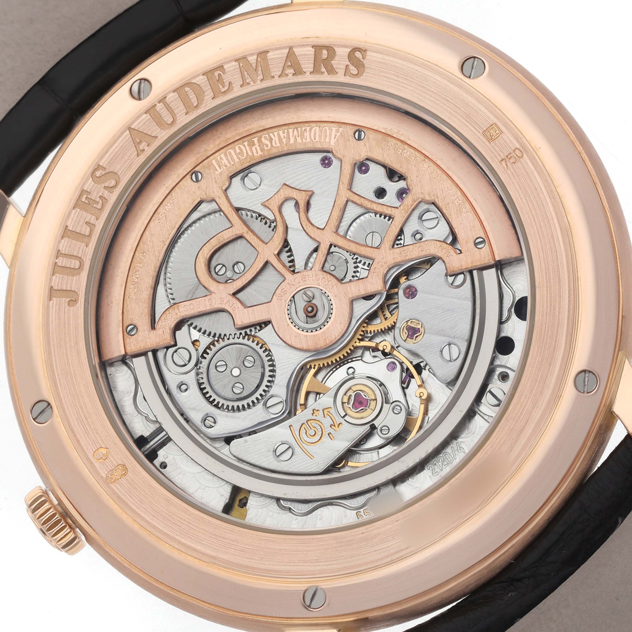 The image shows the back view of the Jules Audemars Piguet watch, highlighting its exposed mechanical movement and case.