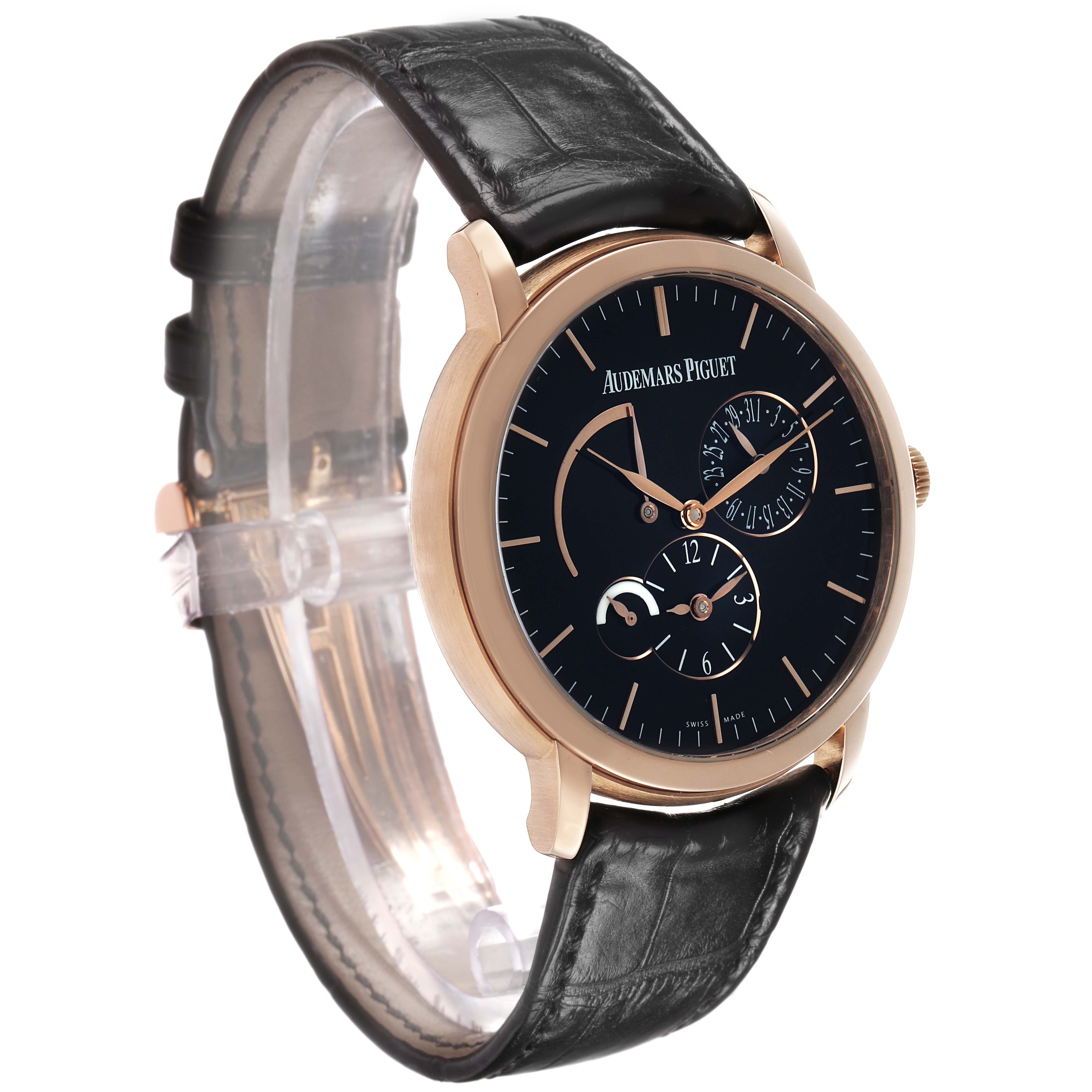 The Audemars Piguet Jules 26380OR Men's Rose Gold Black Dial watch is shown from an angled side view, highlighting the black leather strap and round dial with subdials.