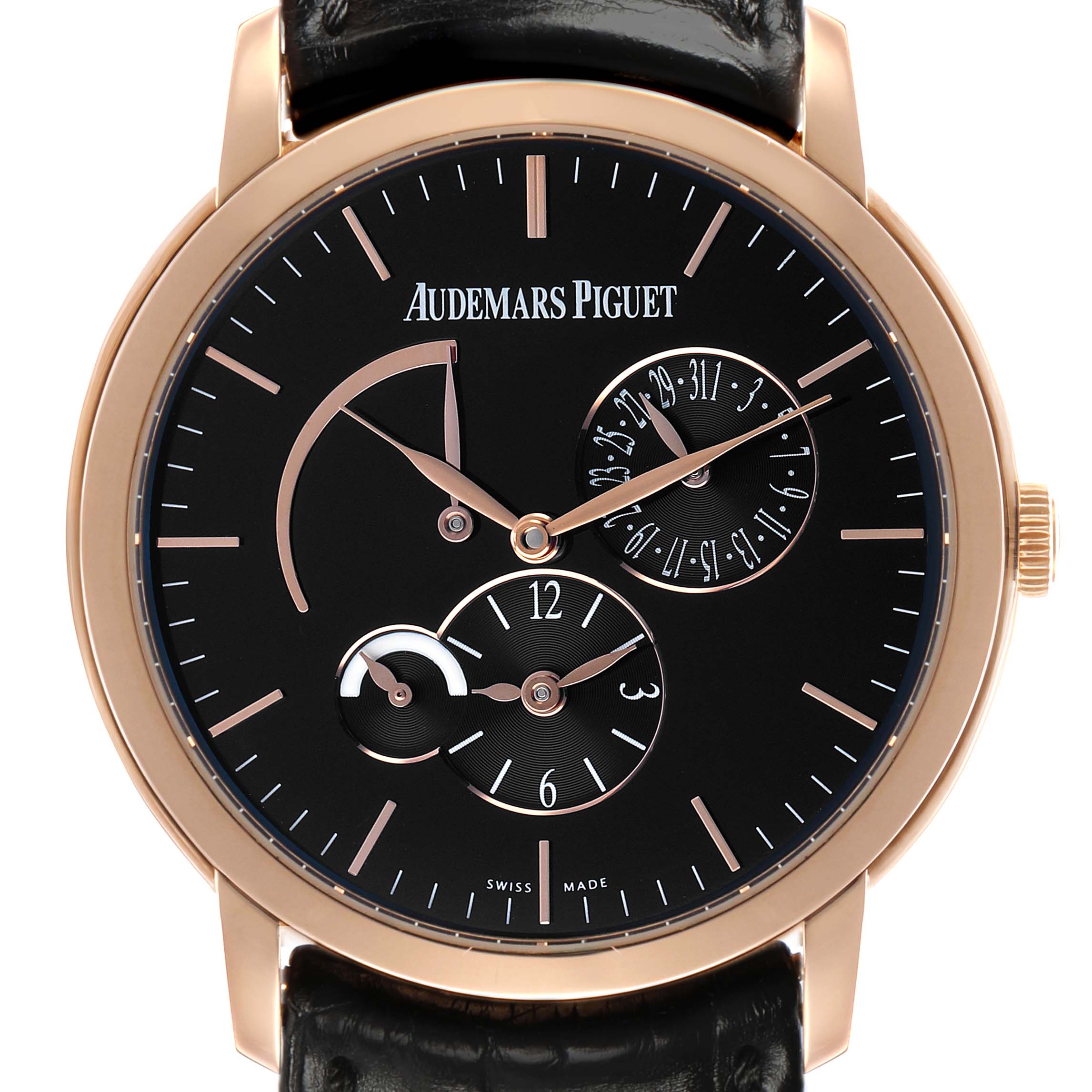 The Audemars Piguet Jules 26380OR Men's Rose Gold Black Dial watch is shown from the front, highlighting its black dial, gold markers, subdials, and leather strap.