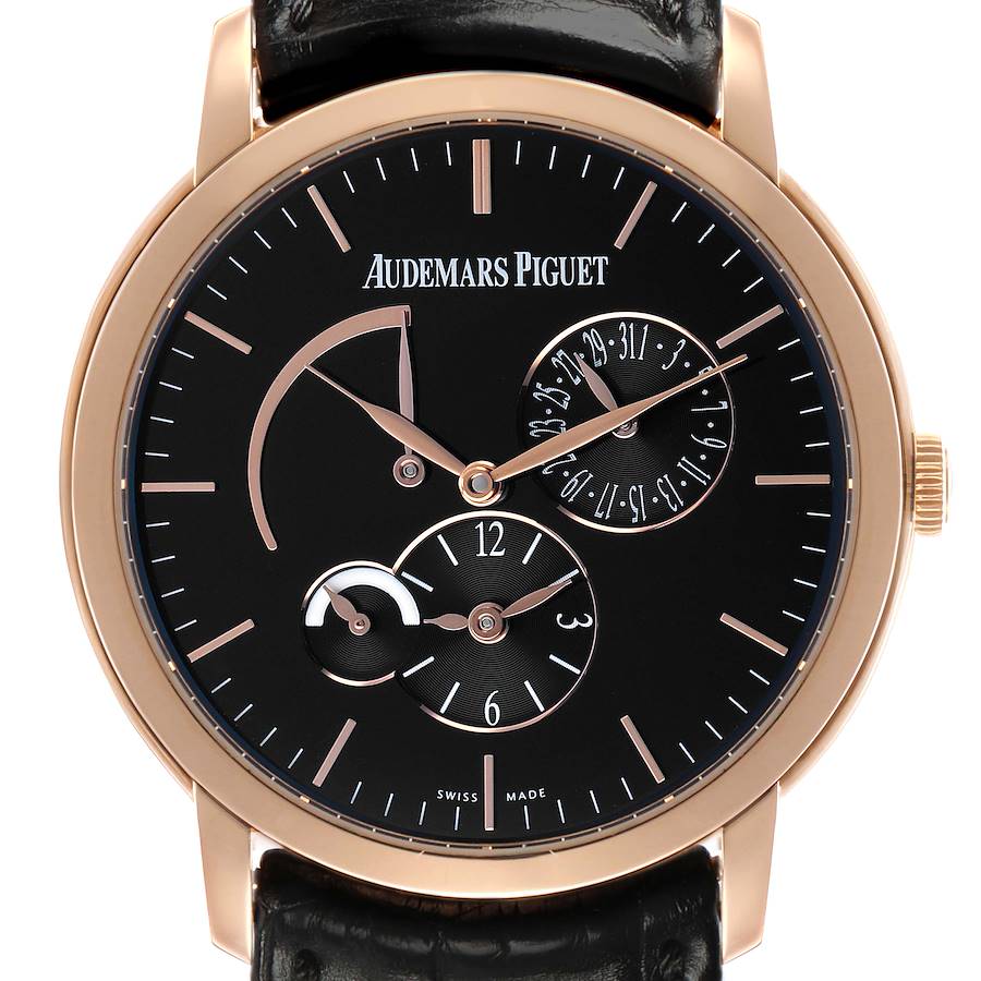 The Audemars Piguet Jules 26380OR Men's Rose Gold Black Dial watch is shown from the front, highlighting its black dial, gold markers, subdials, and leather strap.