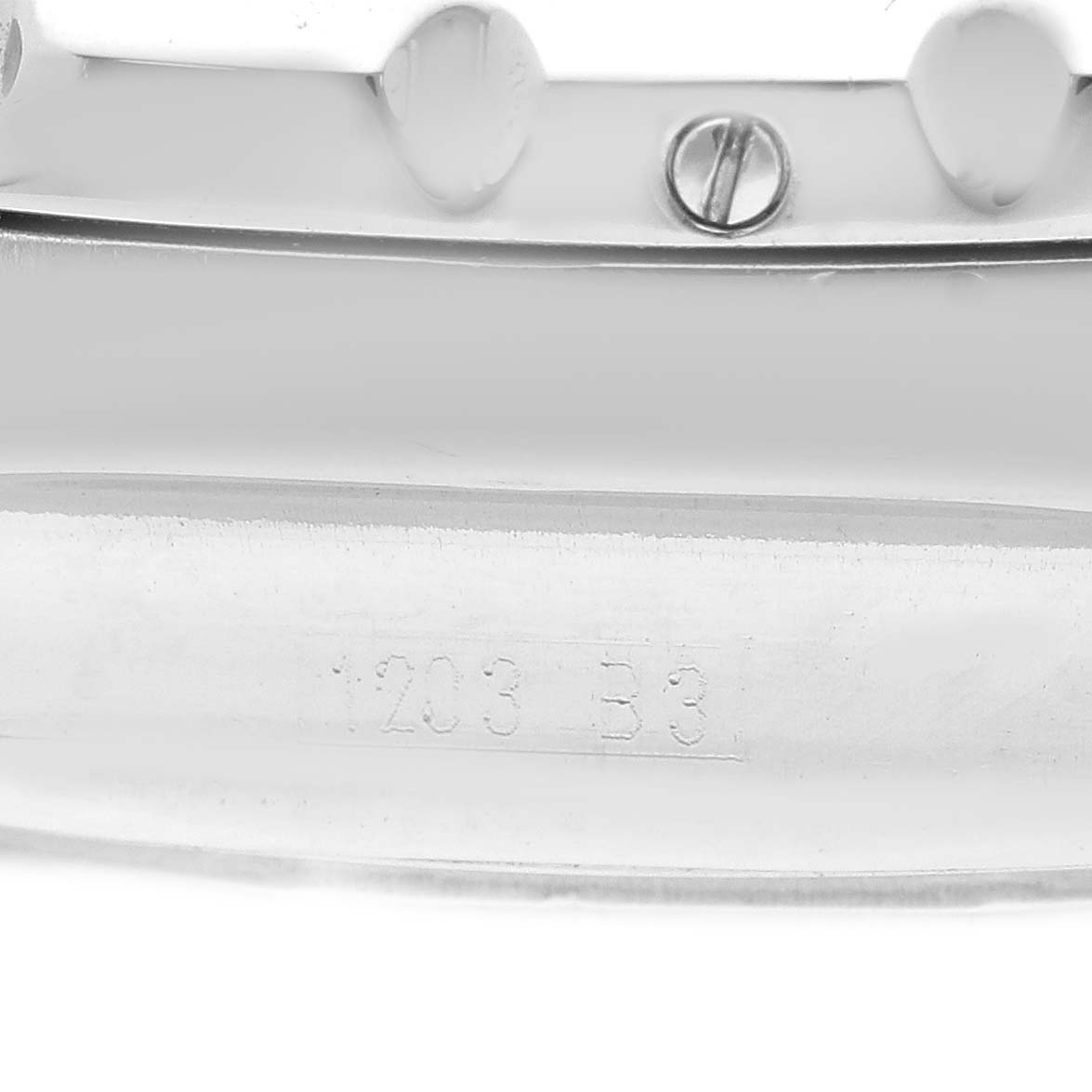 The image shows a close-up of the edge of a Breitling Bentley A25363 Men's Stainless Steel Brown Dial A25363 Men's Stainless Steel Brown Dial watch band and part of the clasp with serial numbers engraved.