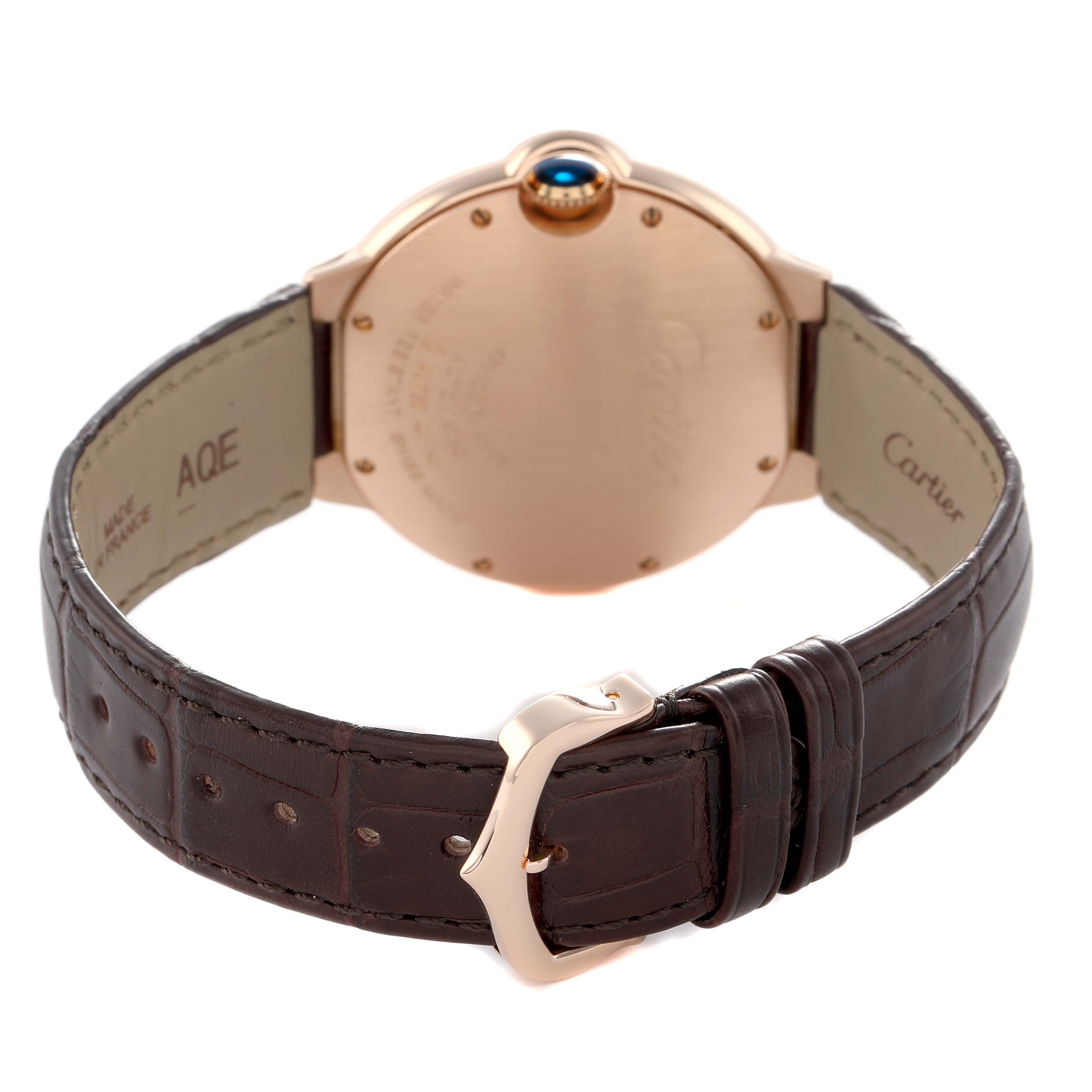 The Cartier Ballon Bleu WGBB0009 Women's Rose Gold Silver Dial watch is shown from the back, highlighting the case back, brown leather strap, and metal clasp.