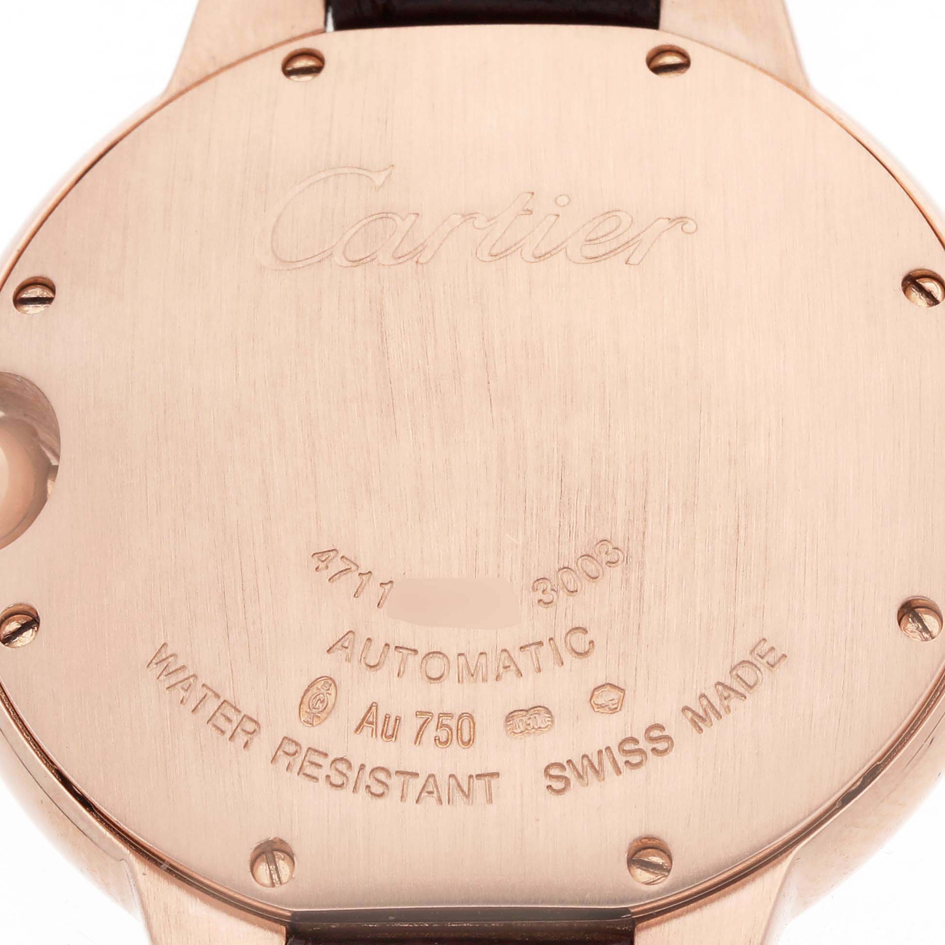 The image shows the back of a Cartier Ballon Bleu WGBB0009 Women's Rose Gold Silver Dial watch with engravings detailing automatic movement and materials.