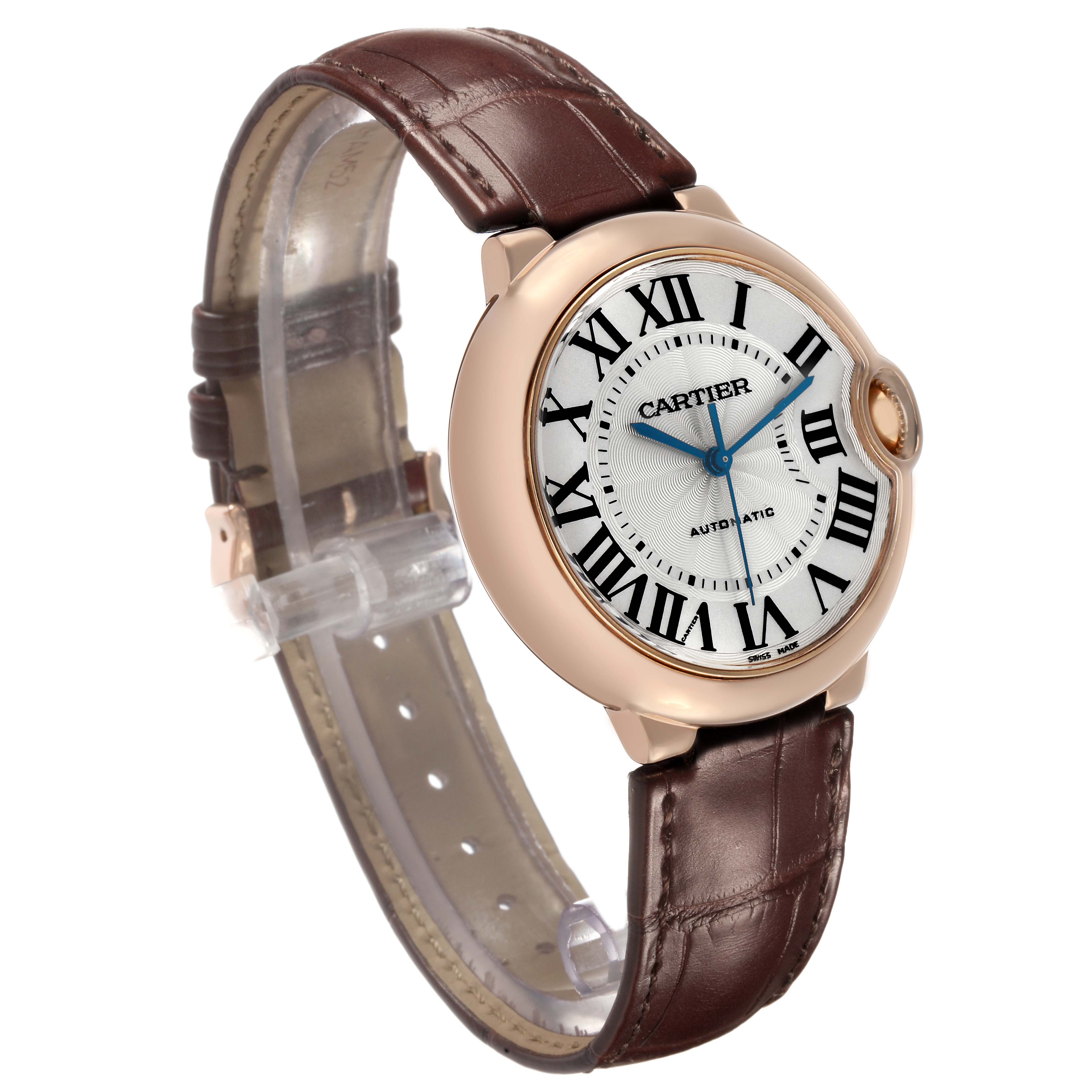The Cartier Ballon Bleu WGBB0009 Women's Rose Gold Silver Dial watch is shown at a slight angle, displaying the face, Roman numerals, blue hands, and leather strap.