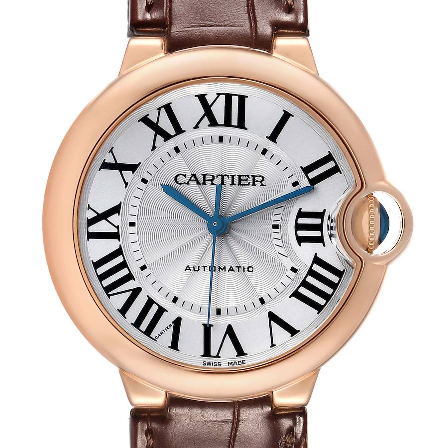 The image shows a frontal view of a Cartier Ballon Bleu WGBB0009 Women's Rose Gold Silver Dial watch, highlighting its round face, Roman numerals, and blue hands.