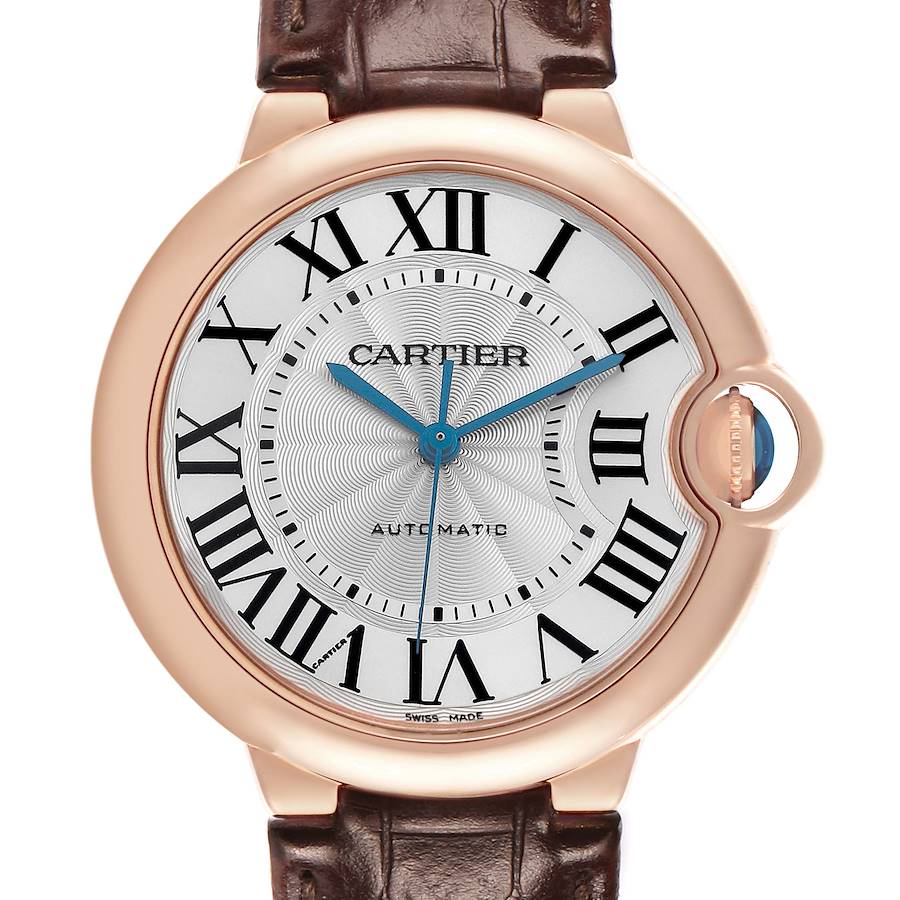 The Cartier Ballon Bleu WGBB0009 Women's Rose Gold Silver Dial watch is shown front-on, featuring a silver dial with Roman numerals, blue hands, and a date window at 3 o'clock.