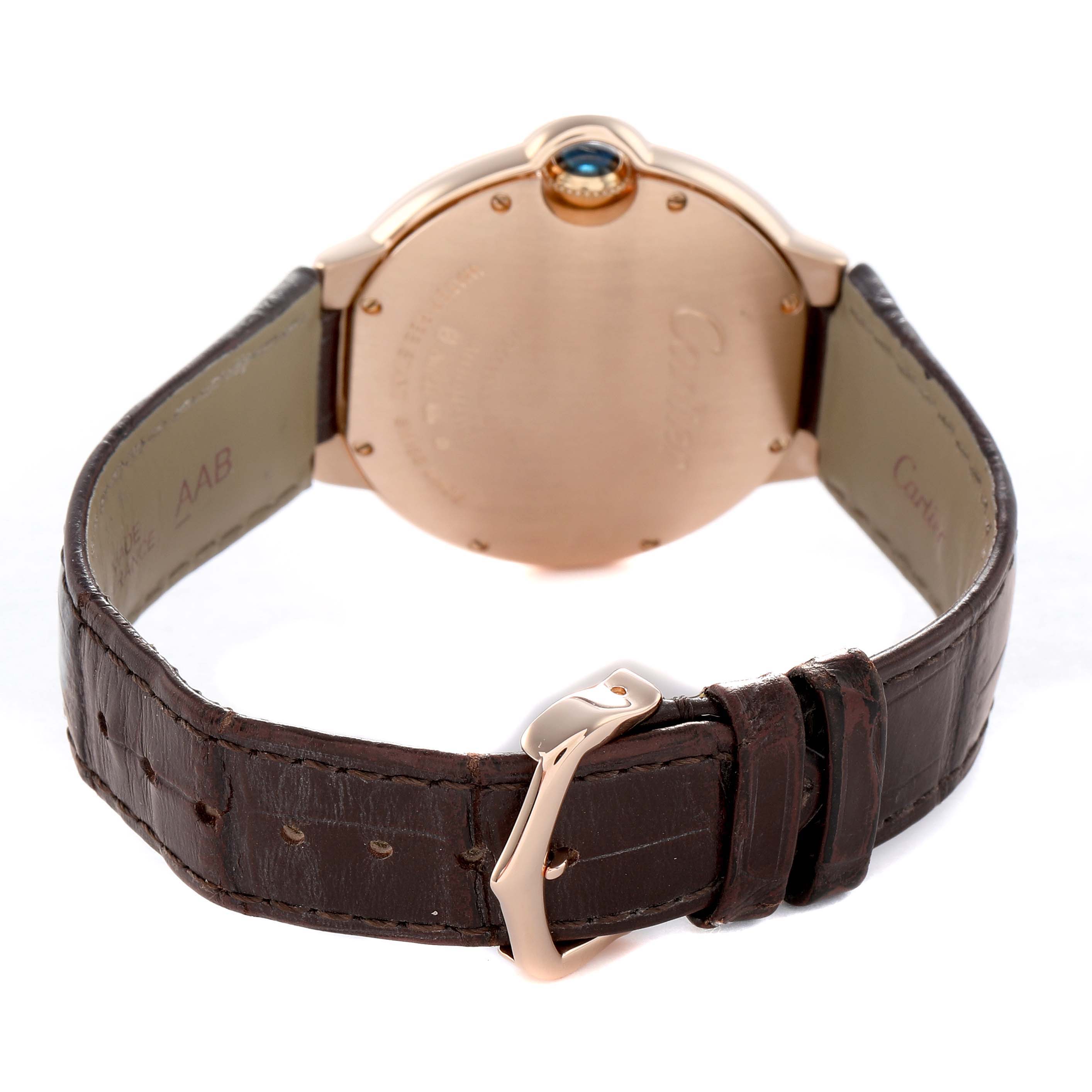The image shows the back of the Cartier Ballon Bleu WGBB0009 Women's Rose Gold Silver Dial watch, highlighting the case, crown with blue cabochon, and brown leather strap.