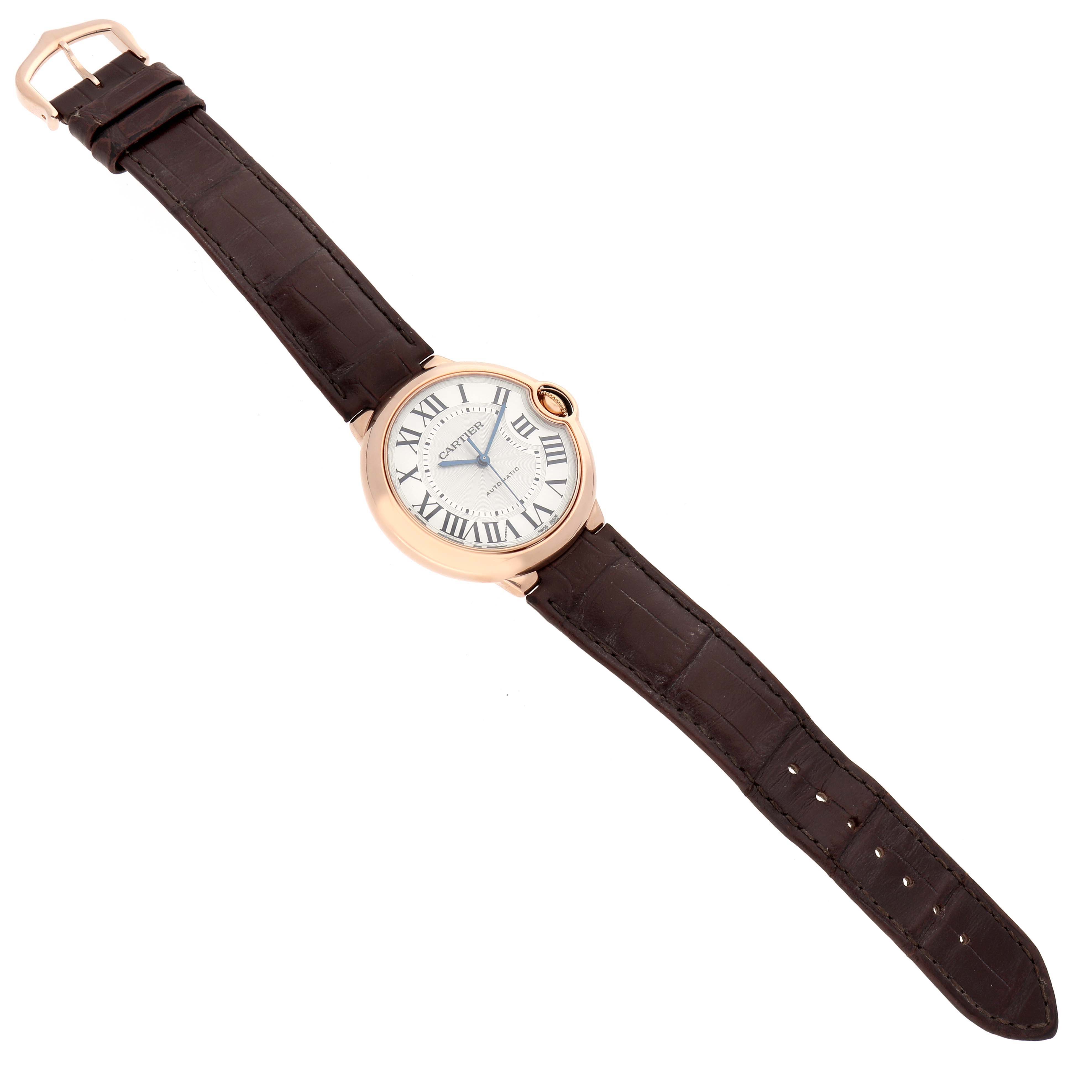 The Cartier Ballon Bleu WGBB0009 Women's Rose Gold Silver Dial watch is shown flat from the top, displaying its face, Roman numerals, and leather strap.