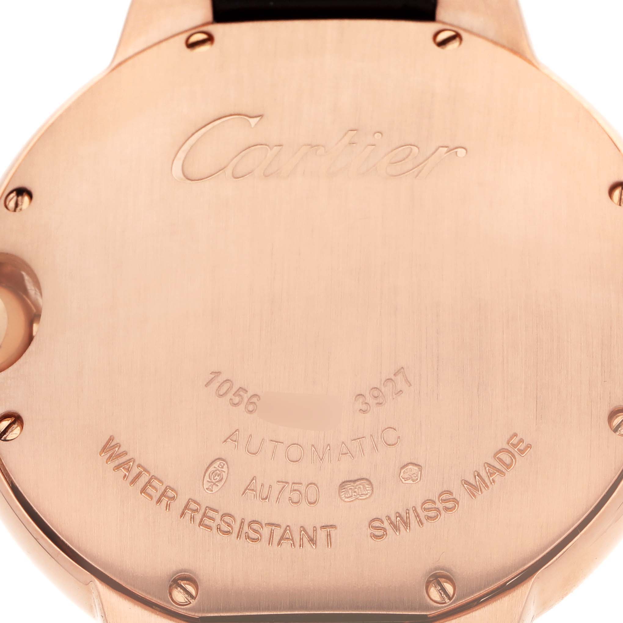 The image shows the engraved case back of the Cartier Ballon Bleu WGBB0009 Women's Rose Gold Silver Dial watch, highlighting brand markings and specifications.