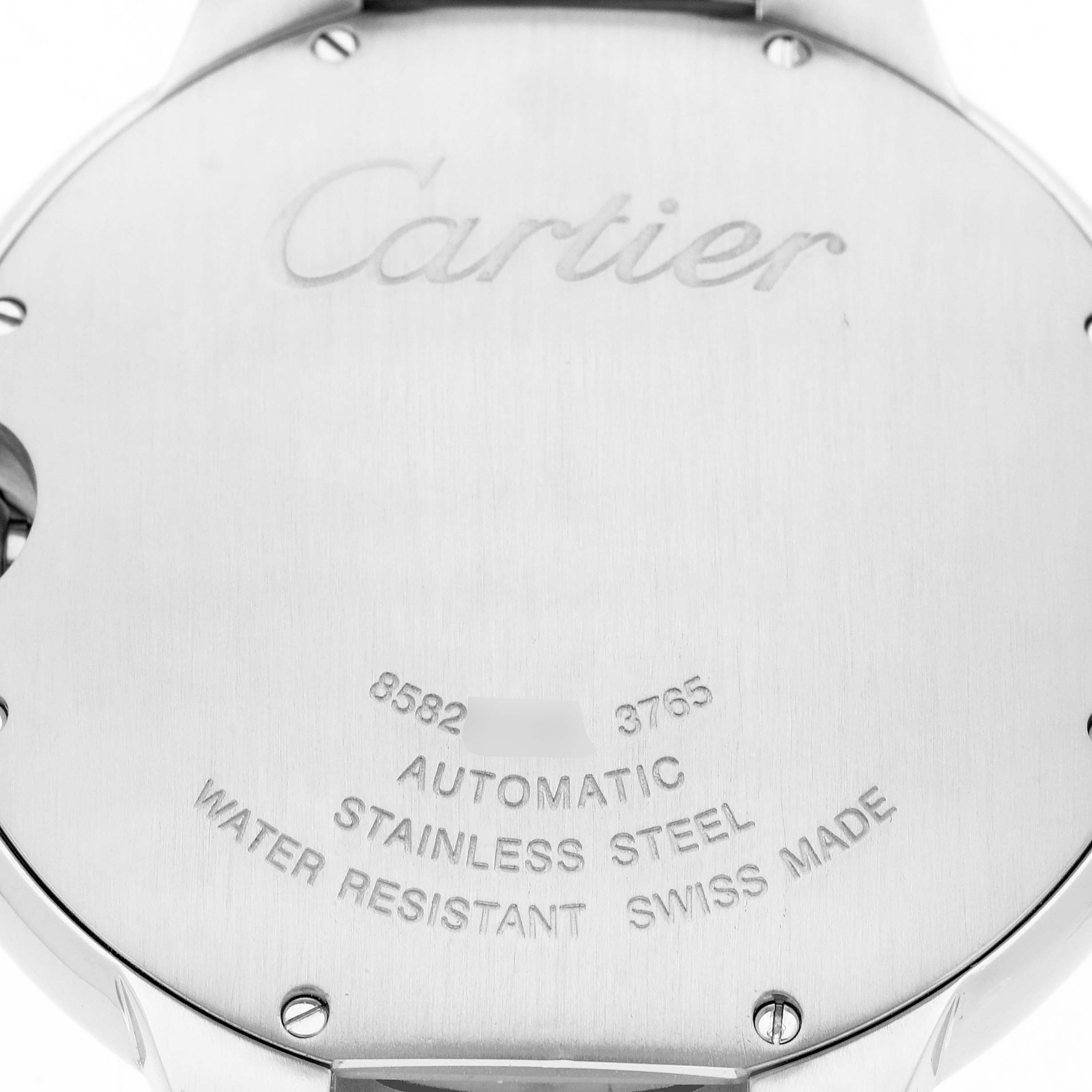 The image shows the back case of a Cartier Ballon Bleu W6920042 Men's Stainless Steel Black Dial watch, engraved with brand details and specifications.
