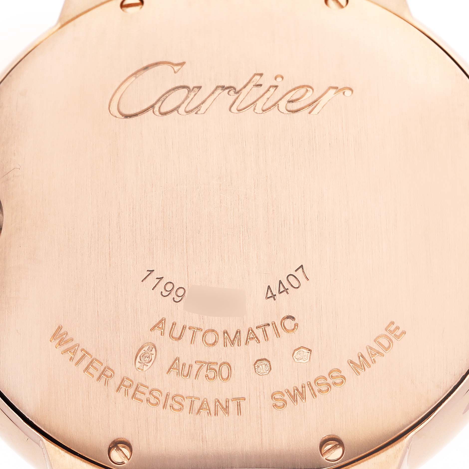 The image shows the back case of a Cartier Ballon Bleu WGBB0053 Women's Rose Gold Silver Dial WGBB0053 Women's Rose Gold Silver Dial watch, highlighting engravings and markings.